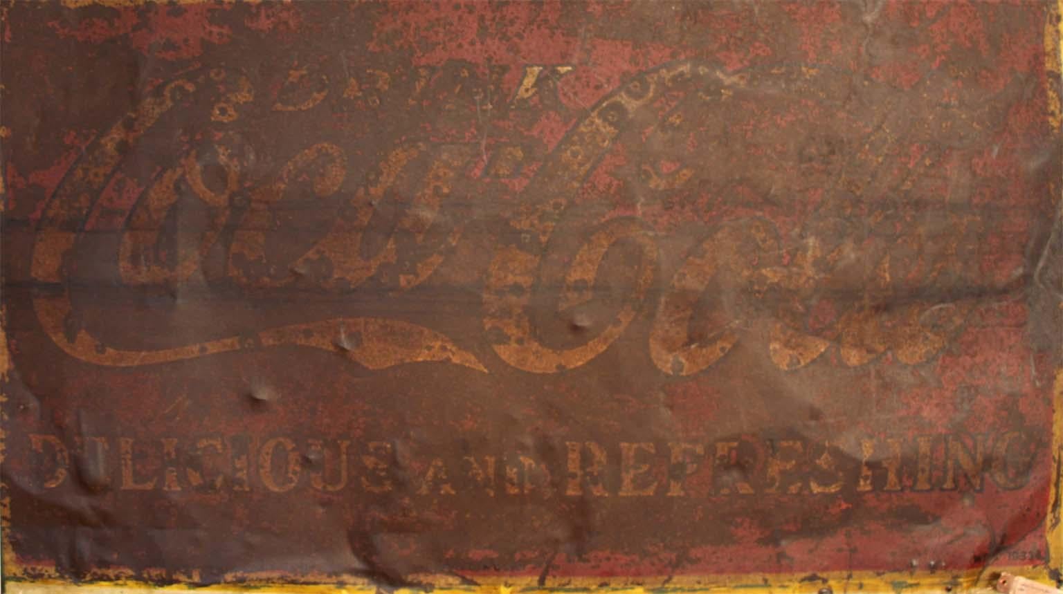 This is an amazing antique metal sign, framed with an image of a Coca Cola bottle. The words Cigars, Tobacco and Candy across the top in faded green paint. The sign is in original condition showing the texture and age of an old metal sign dated