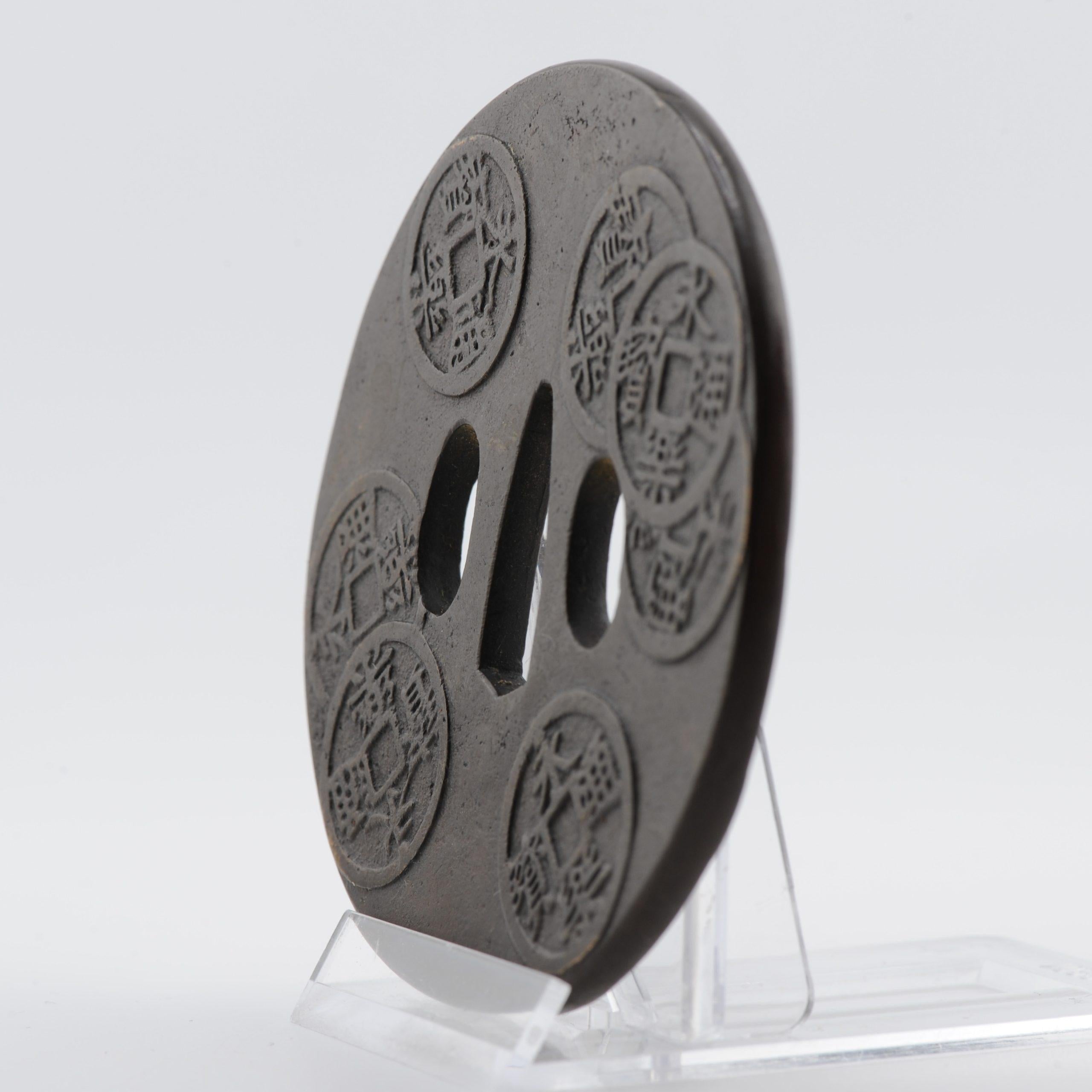Nicely made Tsuba. The piece is unmarked. Dating to the Edo period

Provenance: Collected in the 1920's. Thence by decent

A Tsuba is a Japanese sword mountings are the various housings and associated fittings (tosogu) that hold the blade of a