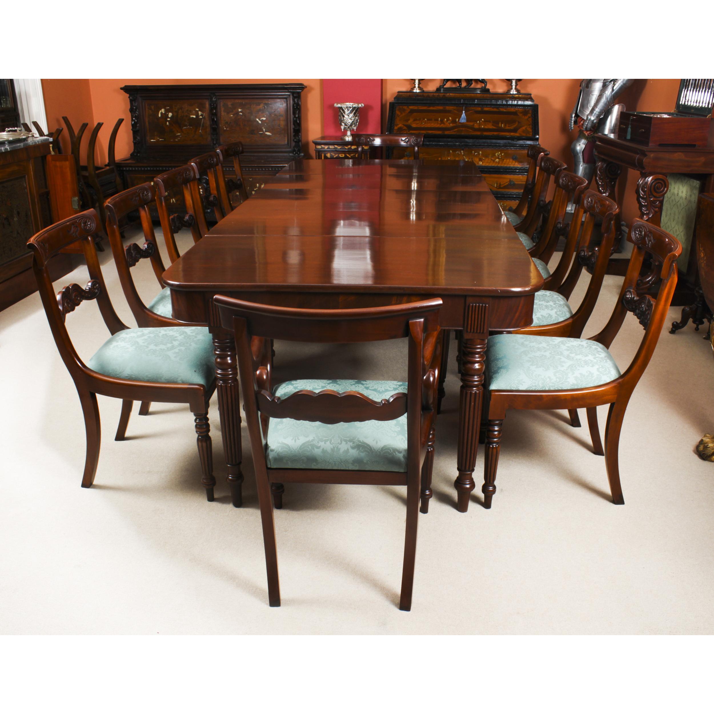 A superb dining suite that comprises a fine antique English Regency Metamorphic dining table in the manner of Gillows, Circa 1830 in date, and a set of twelve barback dining chairs..

This amazing flame mahogany dining table can seat twelve and has