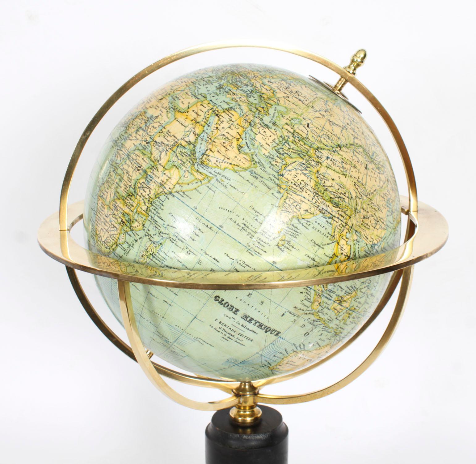 A fine antique French 21 inch Metrique library globe on stand by G. Thomas, 44 Rue Notre Dame des Champs Paris,  Circa 1915 in date.

The globe is raised on a highly decorative ebonised turned stand with brass axis setting.

The globe has a brass