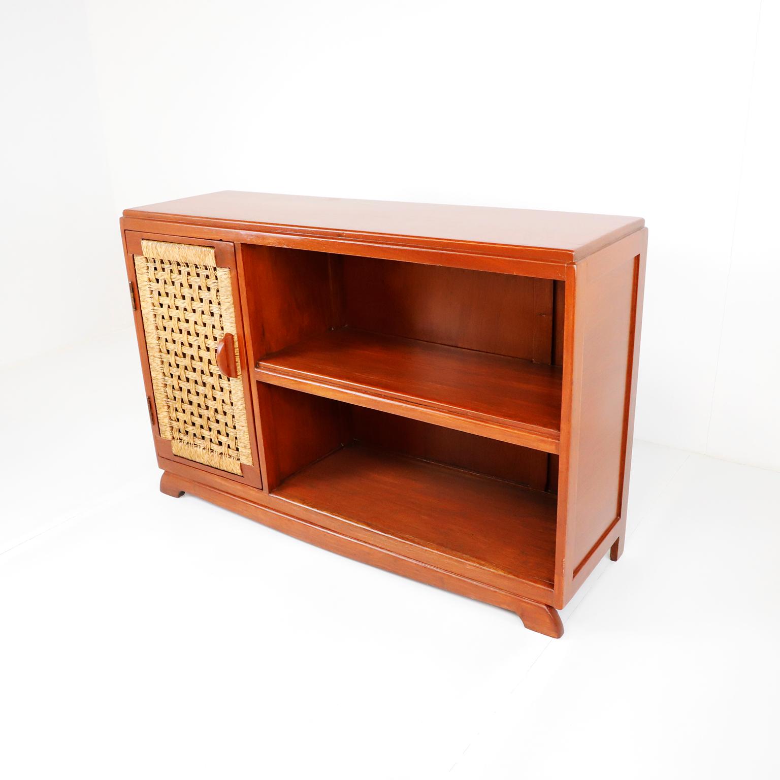 Circa 1950, We offer this Antique Mexican Cabinet by Muebles Austin in solid Mahogany and palm cords.