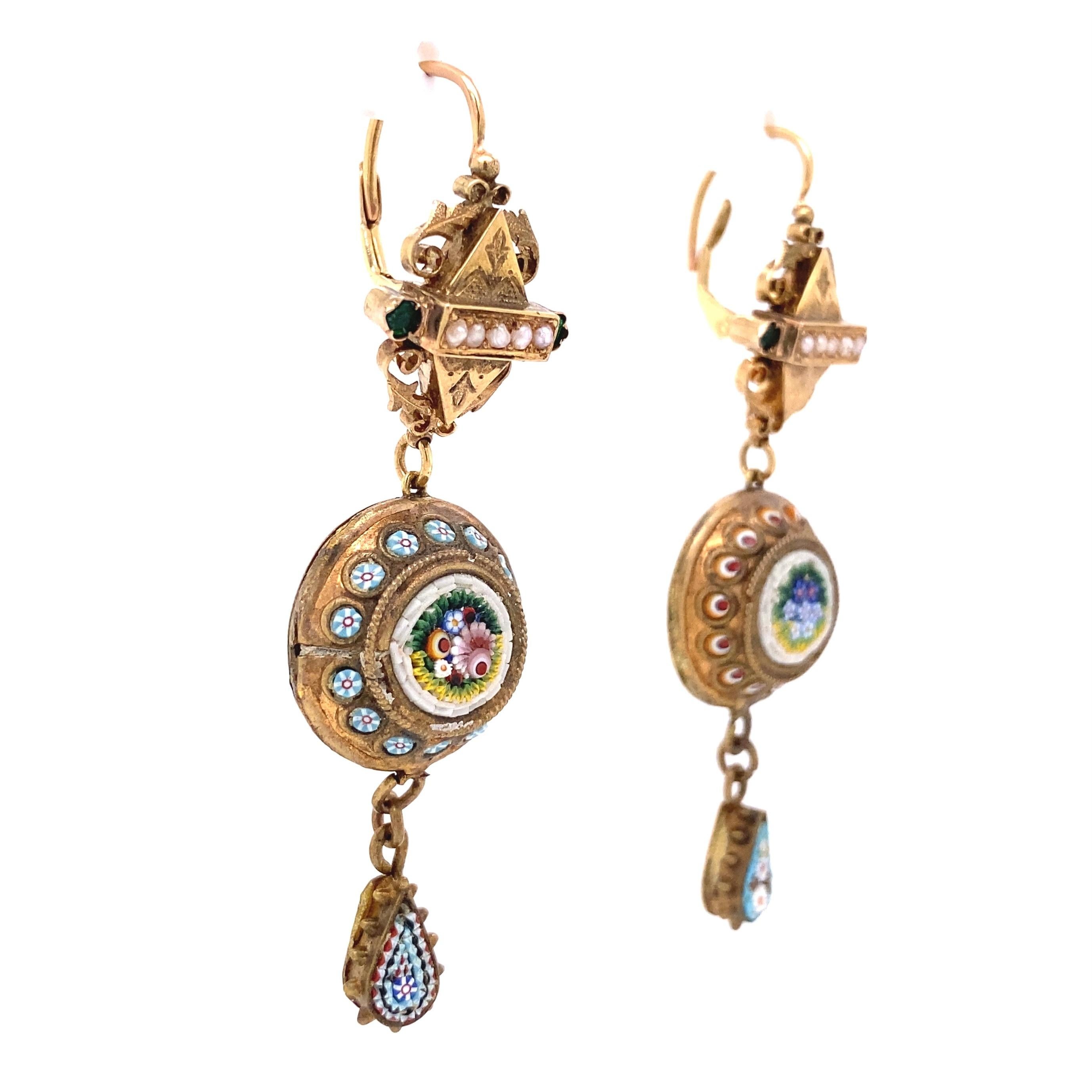 Simply Beautiful Victorian Micro Mosaic Seed Pearl Drop Earrings. Set with 2 Micro Mosaic discs and accented with Seed Pearls and Green Stones. Hand crafted in 14 Karat Yellow Gold Each Earring measures approx. 2.55” l x 0.73” w. Circa 1850s.