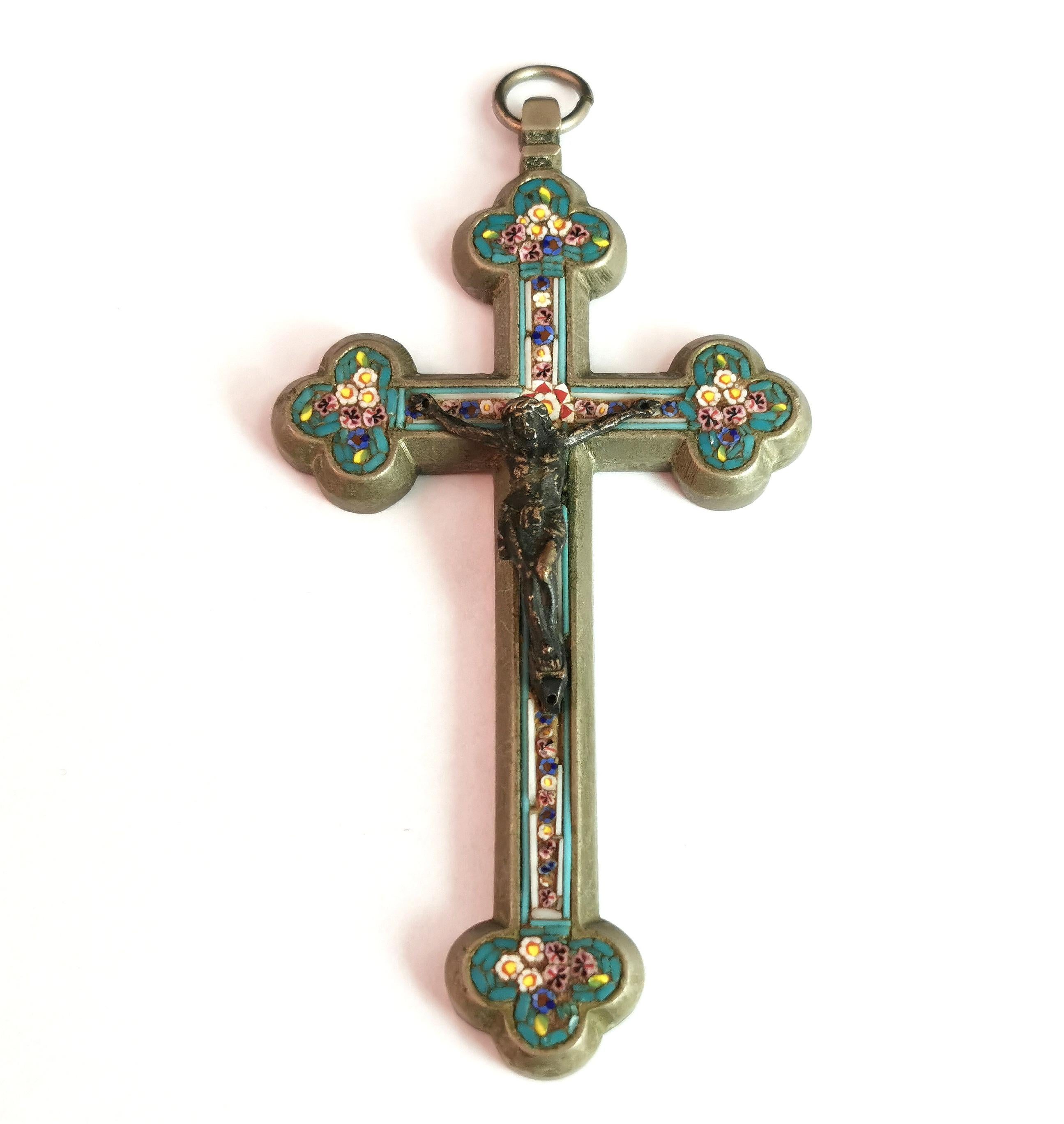 A truly magnificent antique, Italian Micro mosaic crucifix or Cross pendant.

The Cross has an ornate rounded shape and the pretty Tesserae displaying a blue / green ground with multiple floral displays.

The Cross features jesus to the centre in