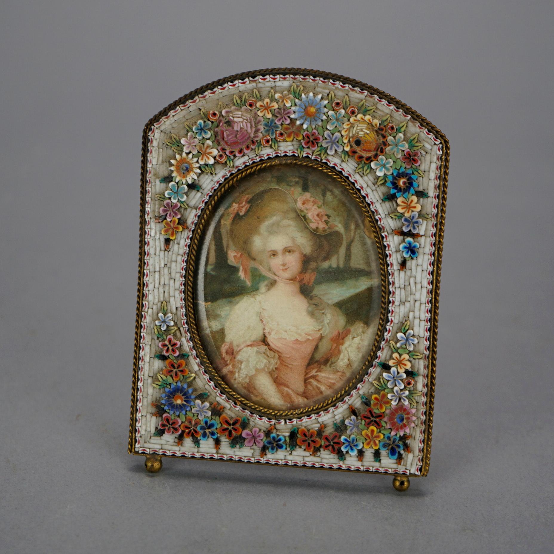 An antique picture frame offers stone micro mosaic design with flowers, c1890

Measures- 4.25''H x 3.5''W x 3.25''D.