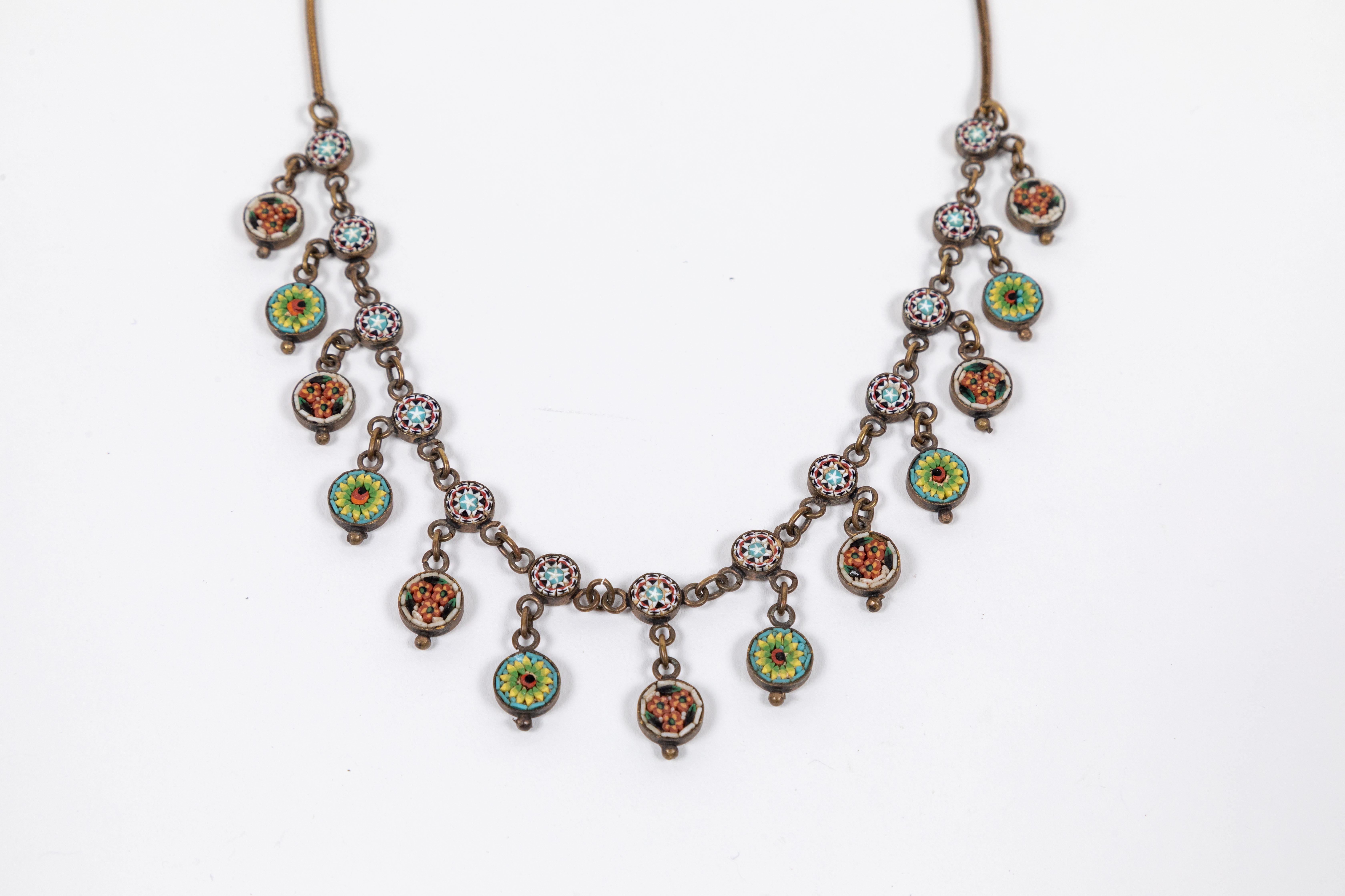 Fabulous Antique Micro Mosaic necklace with 13 multi-color floral design round mosaic drops attached to a chain with hook and eye closure. (c. late 1800s)
Total length is 16