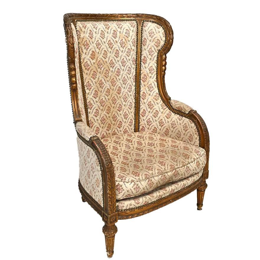 Mid 1800's French Regence Style Carved and Gilt Wood Bergere retaining the original finish in slightly worn condition. Cream brocade silk floral motif upholstery.