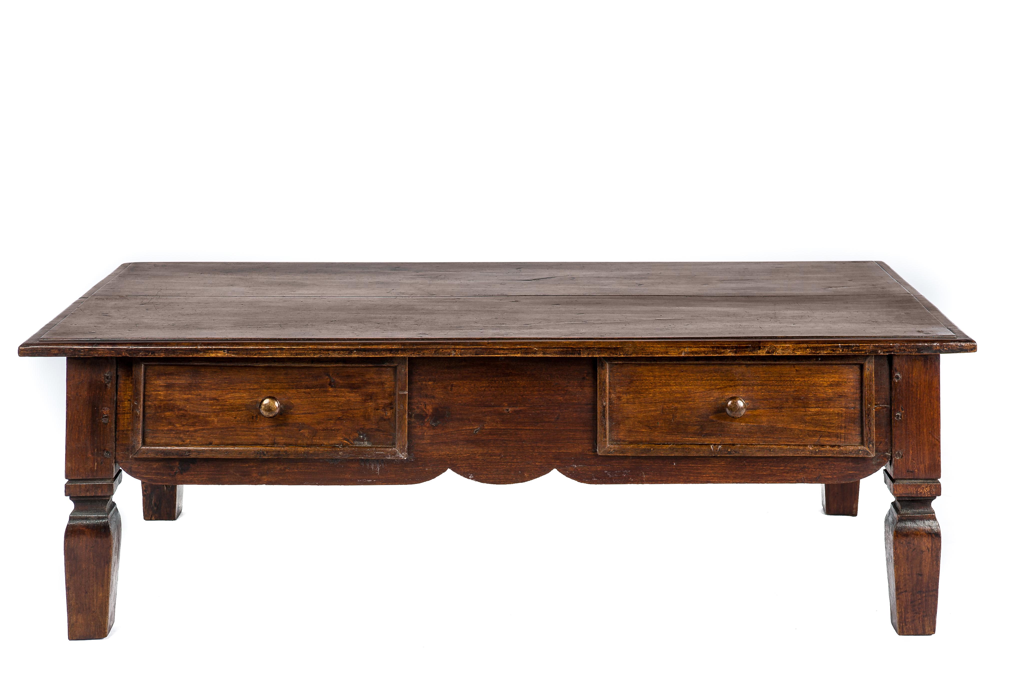 This beautiful warm brown rural coffee table or low table originates in Spain and dates circa 1820. This rustic table has a beautiful top that was made from two boards of solid elm. The top has a beautiful patina and shows many marks and dents