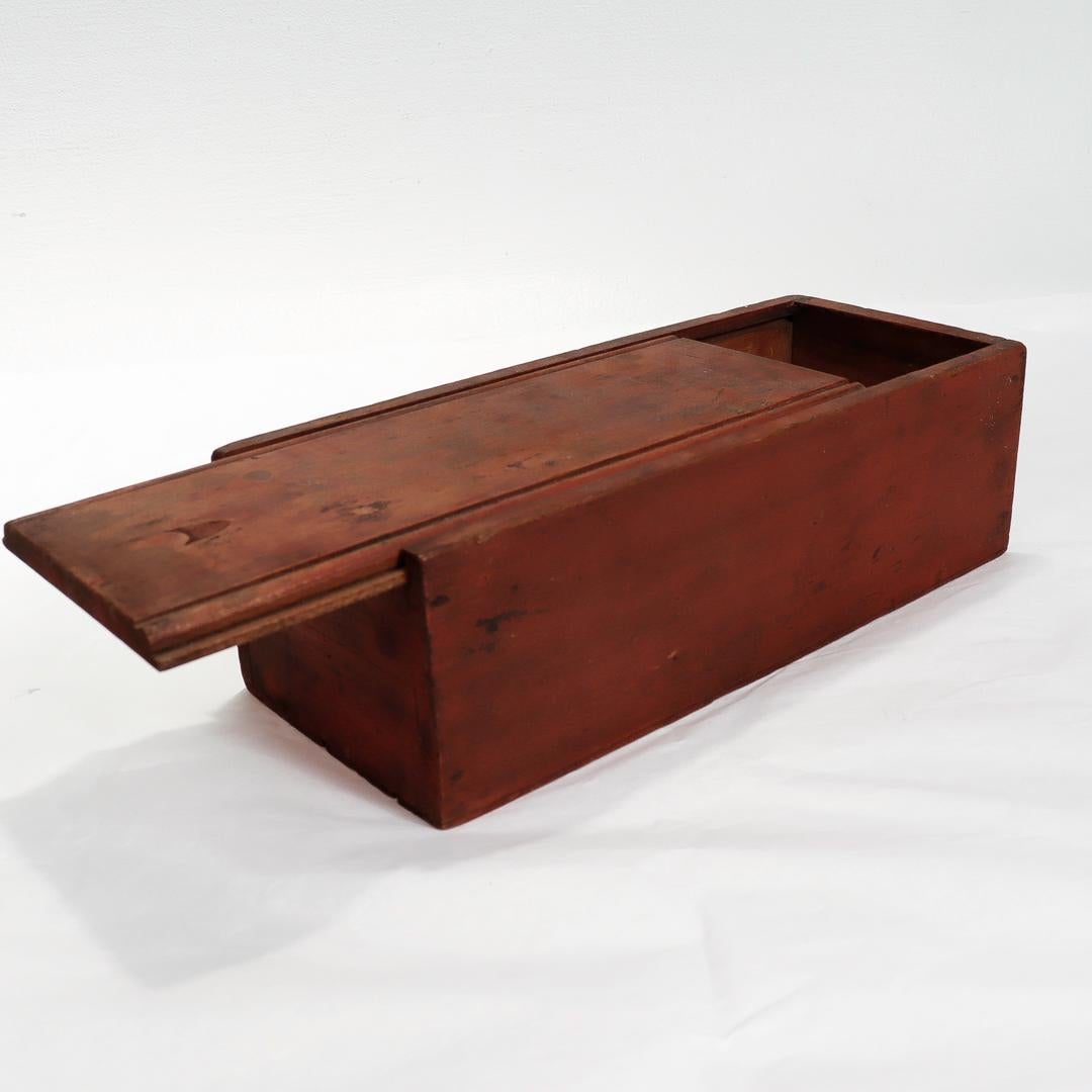 Folk Art Antique Mid-Atlantic States Folky Slide Lid Candle Box with an Original Red Wash For Sale