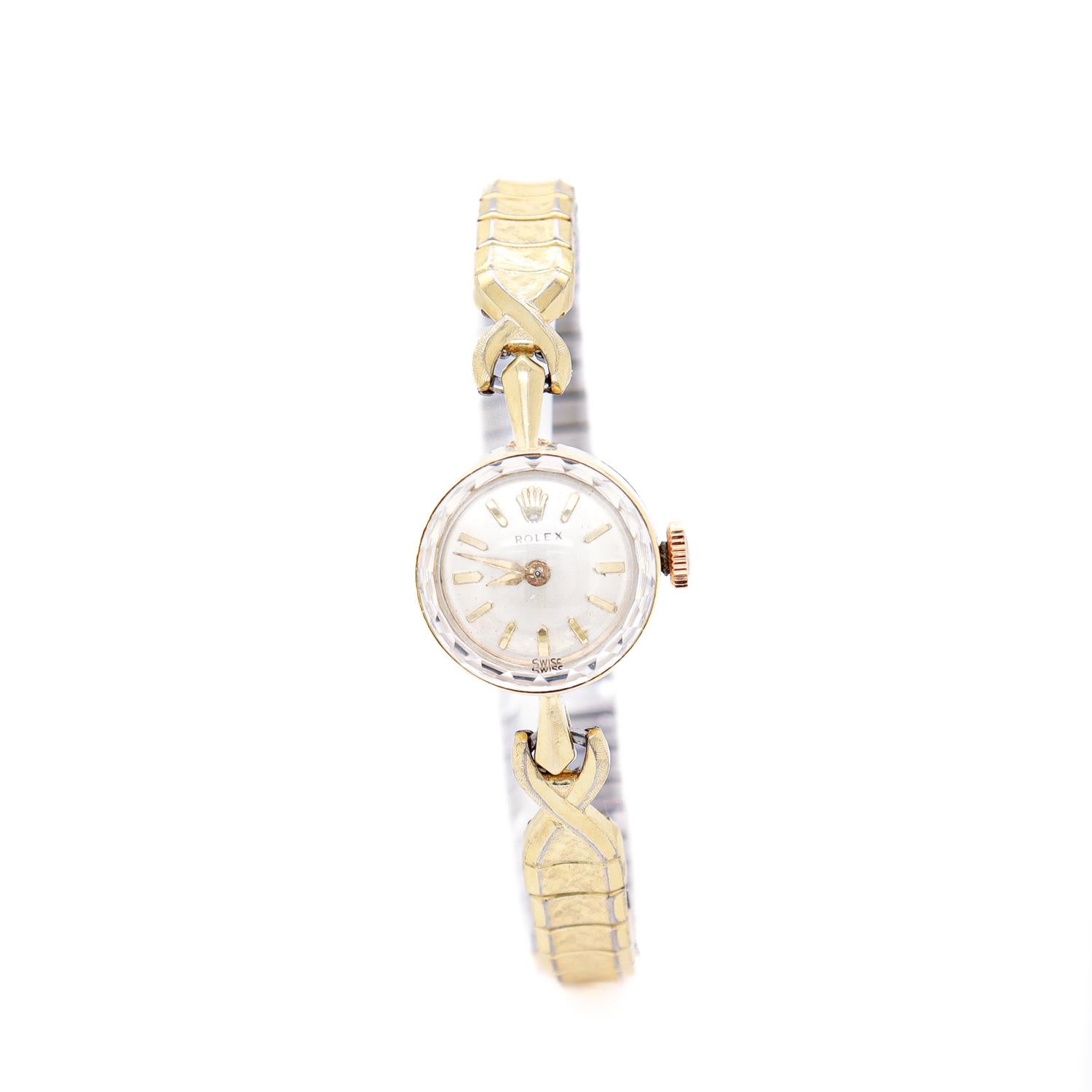 A fine Mid-Century ladies watch.

In 14 karat gold.

With a round case, faceted bezel, and a later expandable gold-plated wristband.

Engraved to the reverse with a dedication to September 1964.

Keeps good time.

Simply a wonderful ladies'