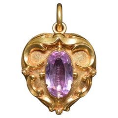 Colgante antiguo de oro amarillo de 15 ct con medallón de amatista