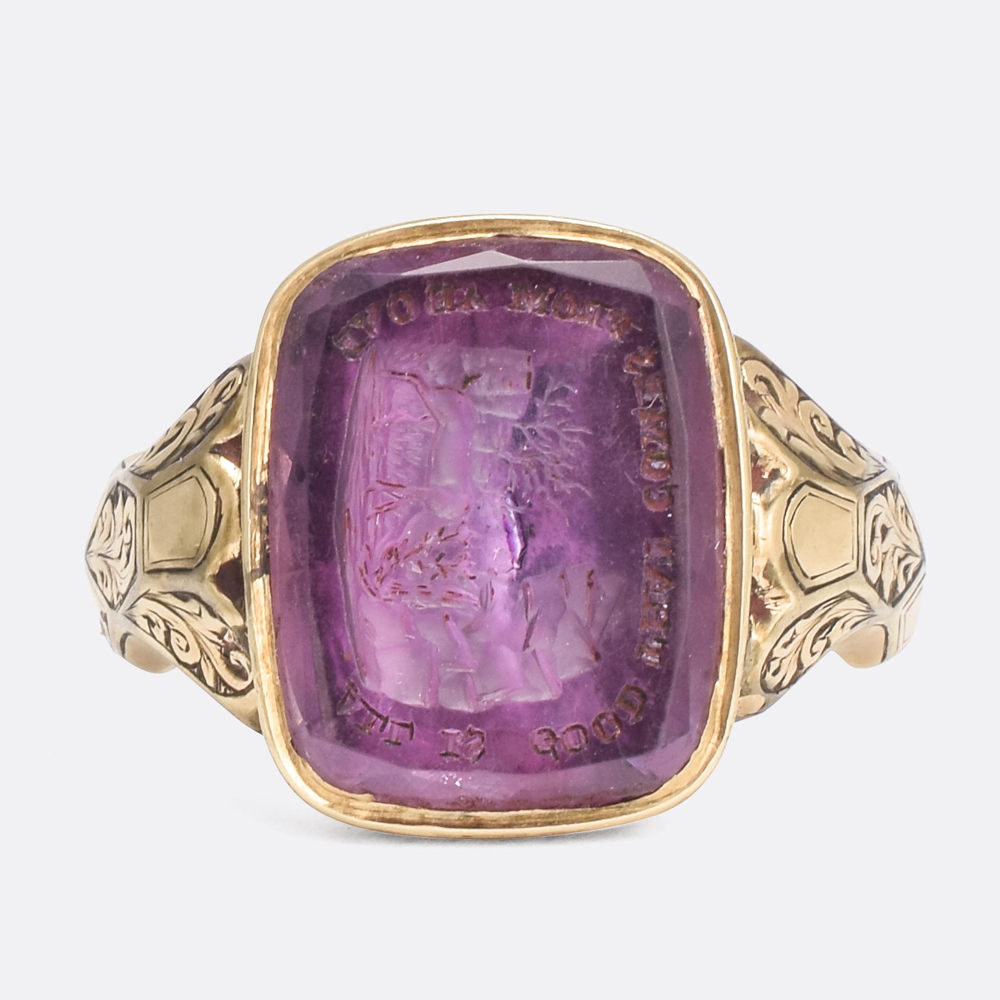 Made in 1860, this superb signet ring is a marvel of Victorian design and craftsmanship. The amethyst has been intaglio carved with the words 