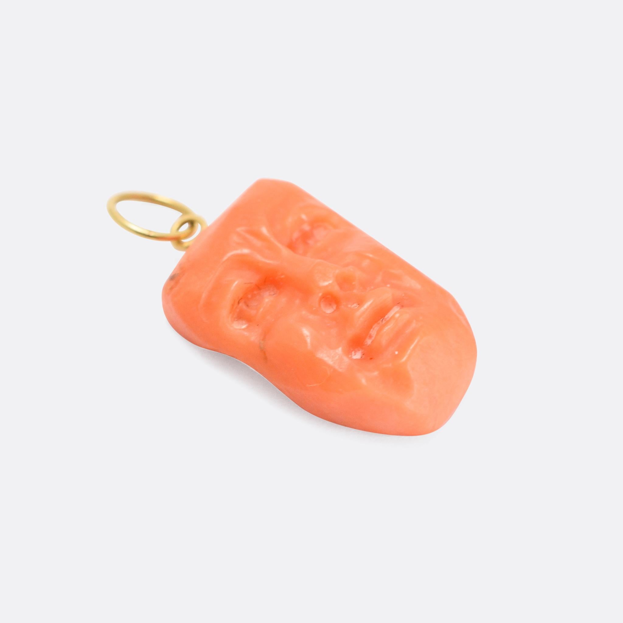 A weird antique pendant dating from the mid Victorian era, circa 1870. It's crafted from a single piece of coral, and has been carved with a face or mask. With gold fittings at the top for wear as a pendant.

STONES 
Coral

MEASUREMENTS 
2.1 x