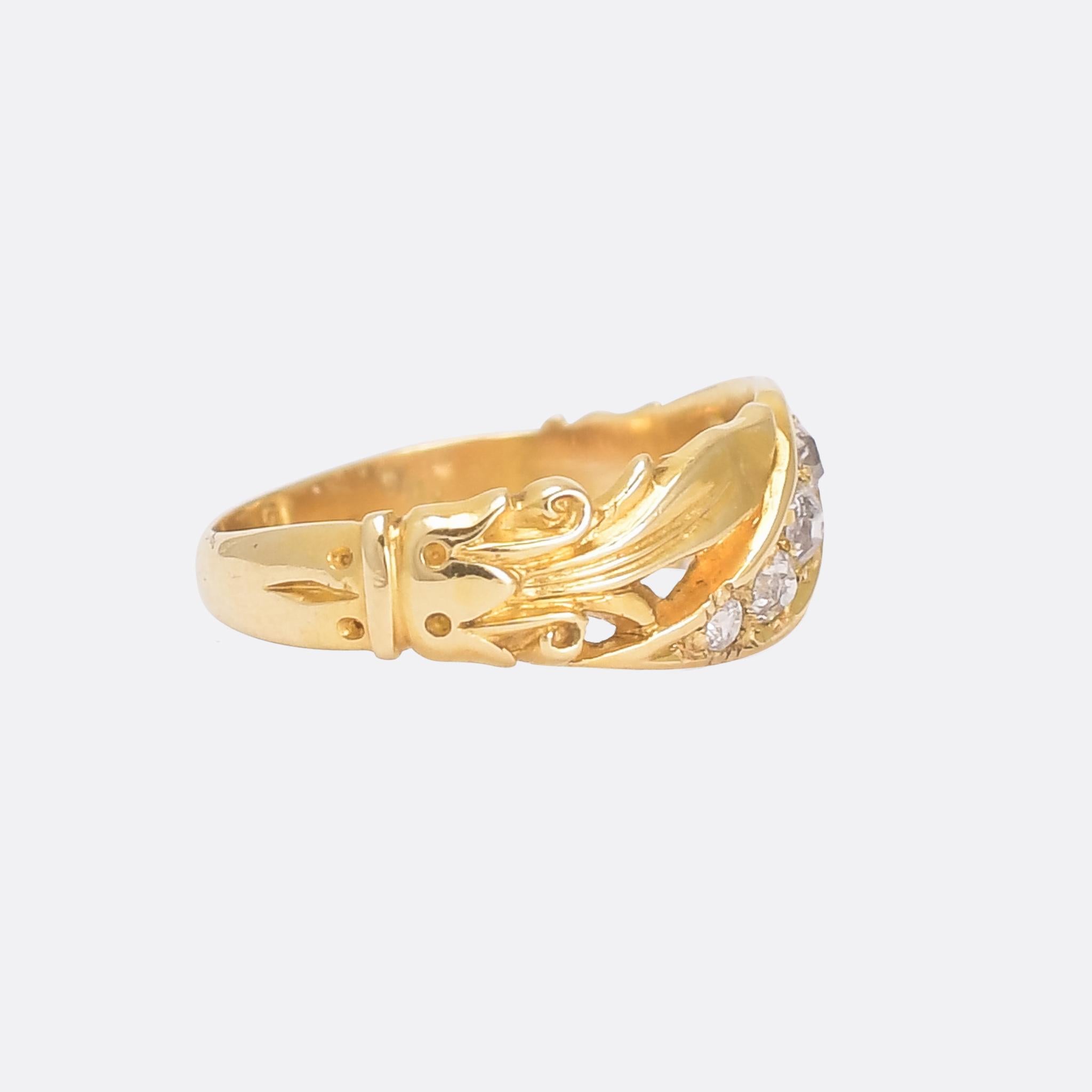 A gorgeous mid Victorian diamond band dating from 1874. The diamonds are set diagonally across the band, and flanked by hand carved scroll and foilate motifs. It's modelled in 18 karat gold, ideal for stacking but interesting enough to be worn on
