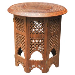 Antique Middle Eastern Circular Carved Table With Repetitive Brass Inlay