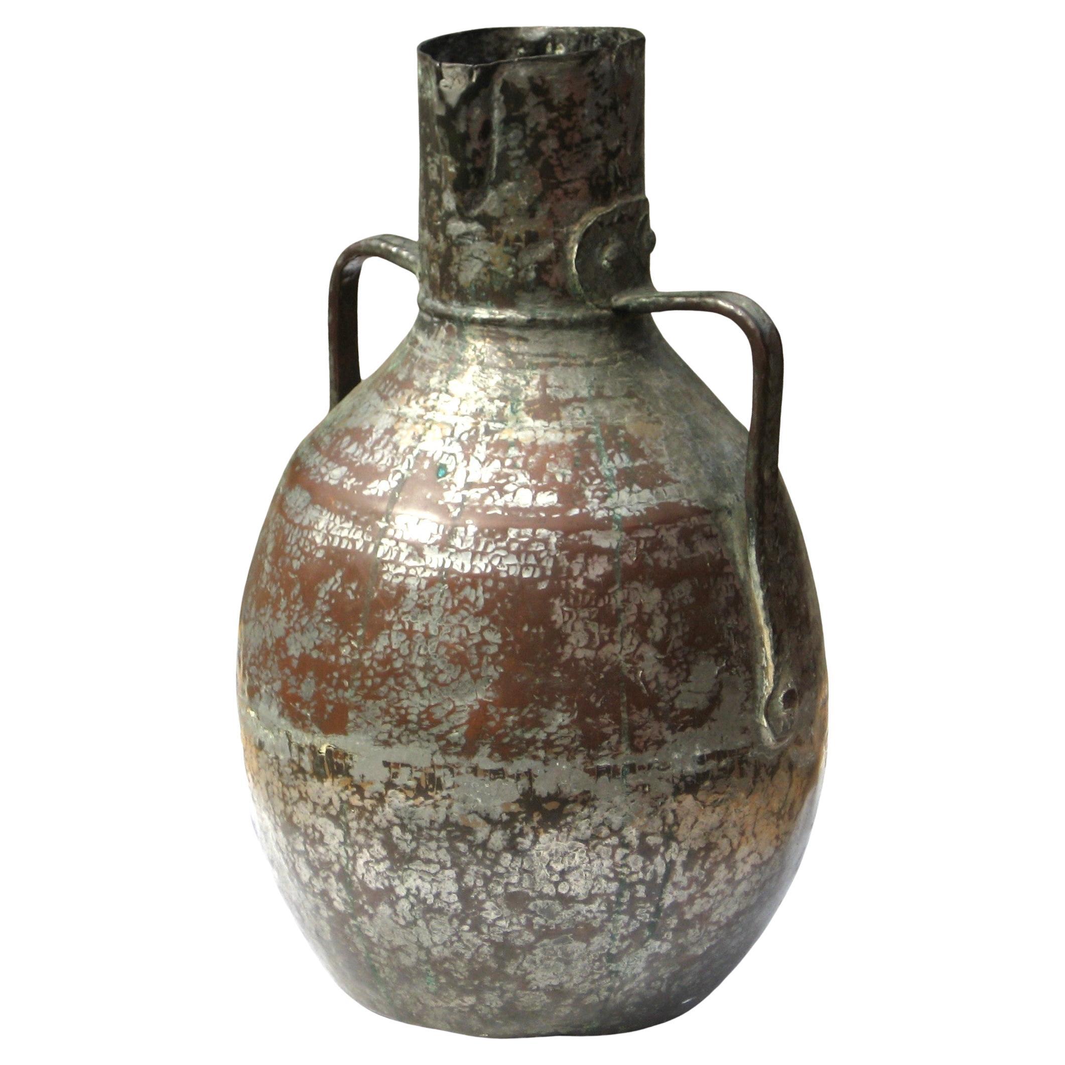 Antique middle eastern larged copper two handled vessel with wear to original silver tinned finish. Syrian in origin - mid 19th century - possibly earlier. Measures 17