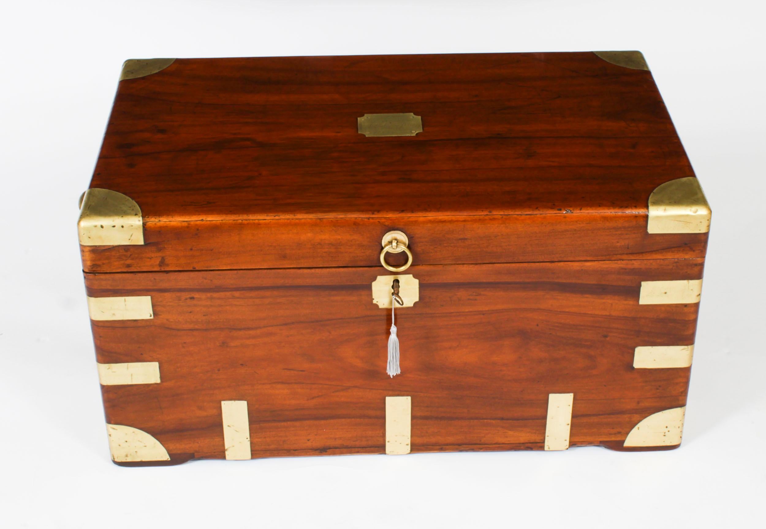 This is beautifully crafted antique Georgian camphorwood military campaign trunk or coffer, ideal for use as a coffee table. It bears an inset brass plaque inscribed 'A H Crawford', andis circa 1820 in date.

This antique trunk is made from the