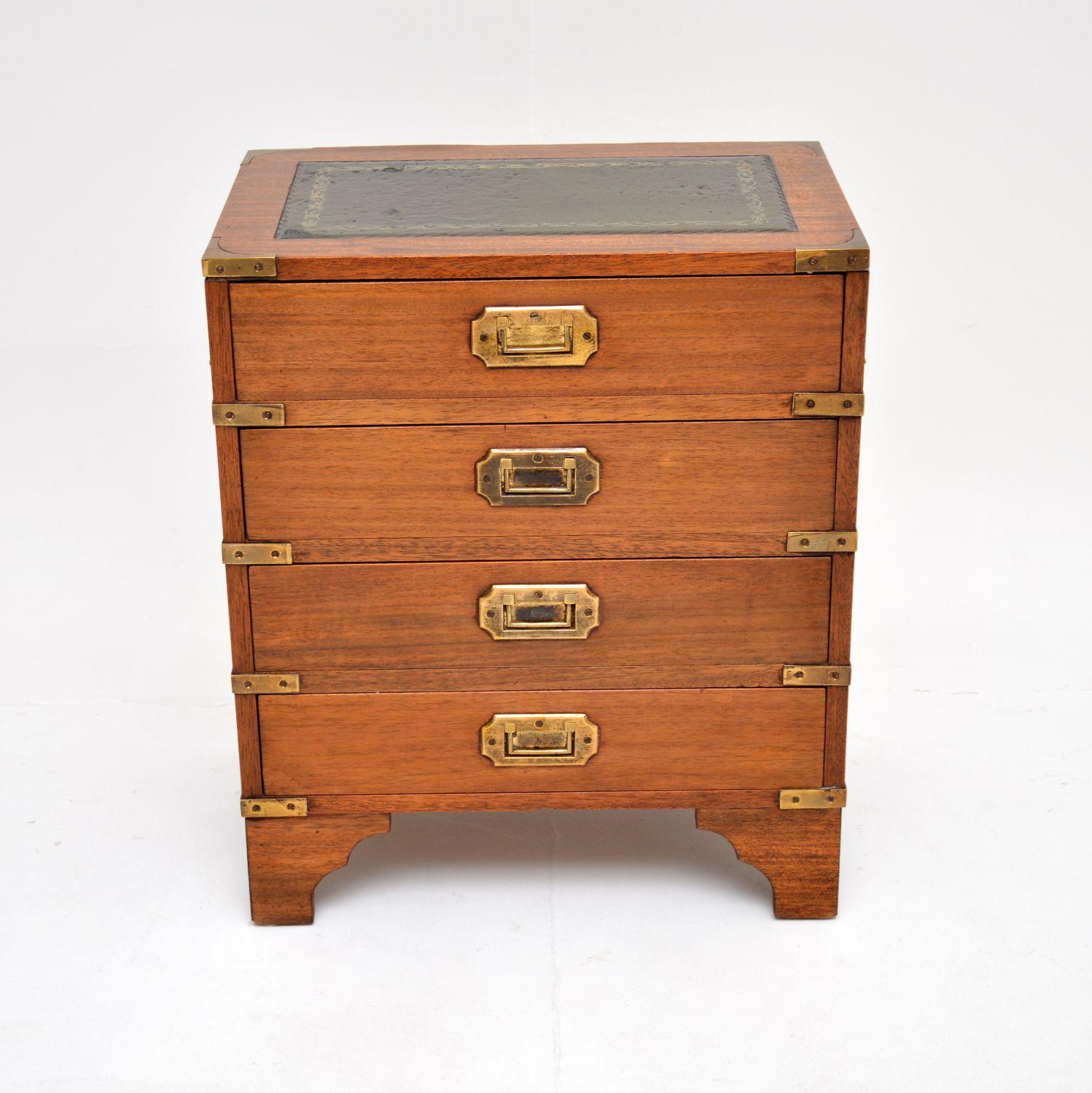 A smart and very well made antique chest of drawers in the military campaign style. This was made in England, it dates from around the 1930’s.

It is of lovely quality and is a very useful size, quite small and low, perfect for a bedside chest or