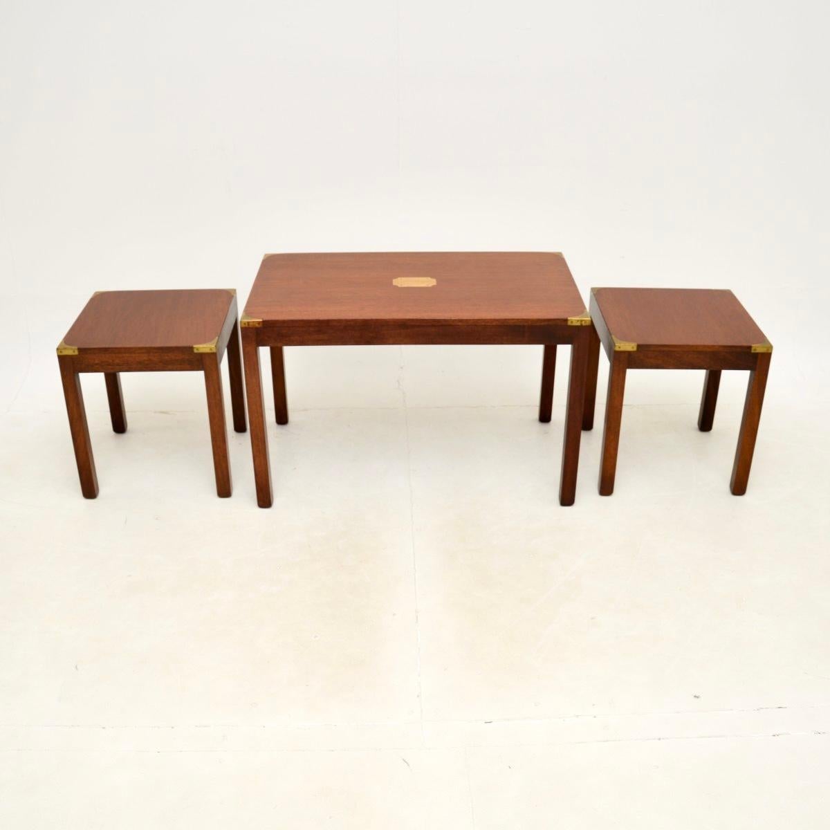 A wonderful antique military campaign nesting coffee table / side tables. These were made in England, they date from around the 1930’s.

They are of excellent quality and have a very useful design. The two smaller side tables nest under the larger