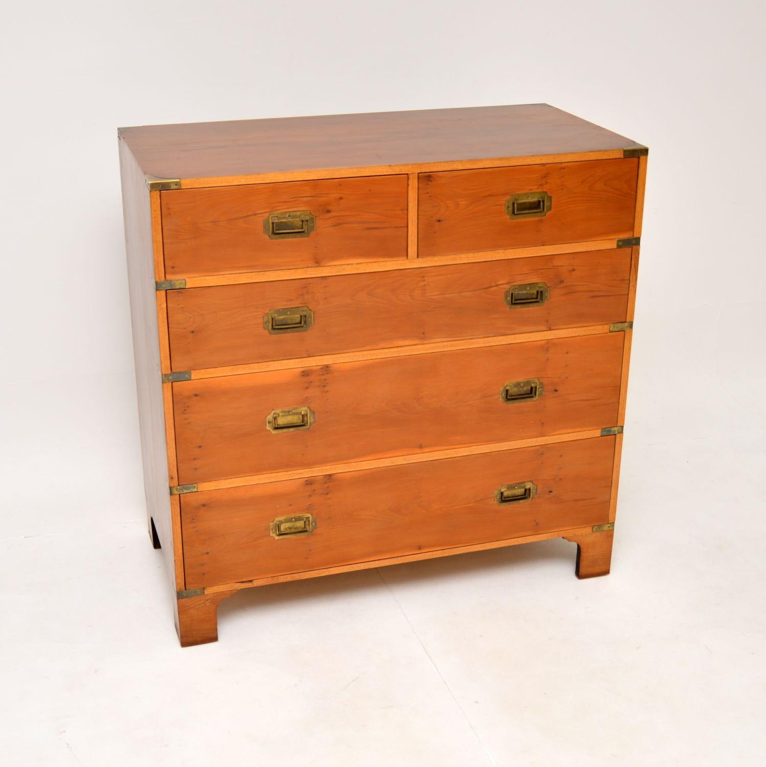 A fantastic antique military campaign style chest of drawers in yew wood. This was made in England, it dates from around the 1950’s.

It is really nice quality and is a very useful size. The yew wood has a lovely colour tone and grain patterns, this