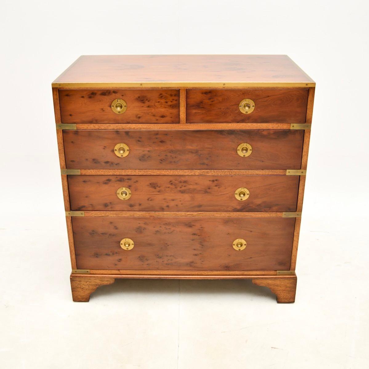 A fantastic antique military campaign style chest of drawers in yew wood. This was made in England, it dates from around the 1930’s.

It is of superb quality and is a very useful size. The yew wood has a gorgeous colour tone and grain patterns, this