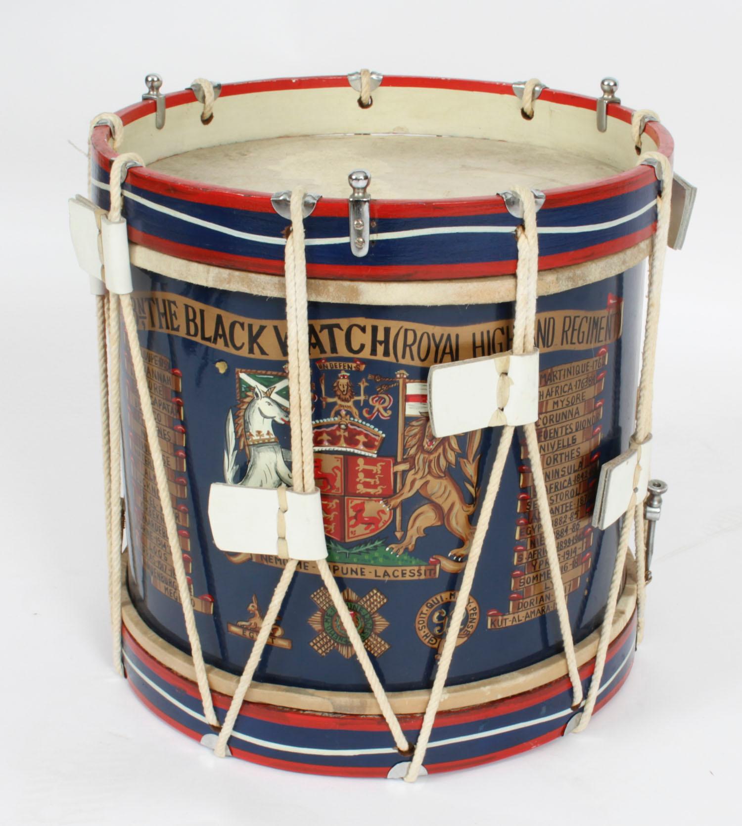This is an elegant antique wood, brass and leather military drum, dating from the early 20th century.

It bears superb painted decoration of The Black Watch (The Royal Highlanders).
 
The unique quality and elaborate design of this drum are