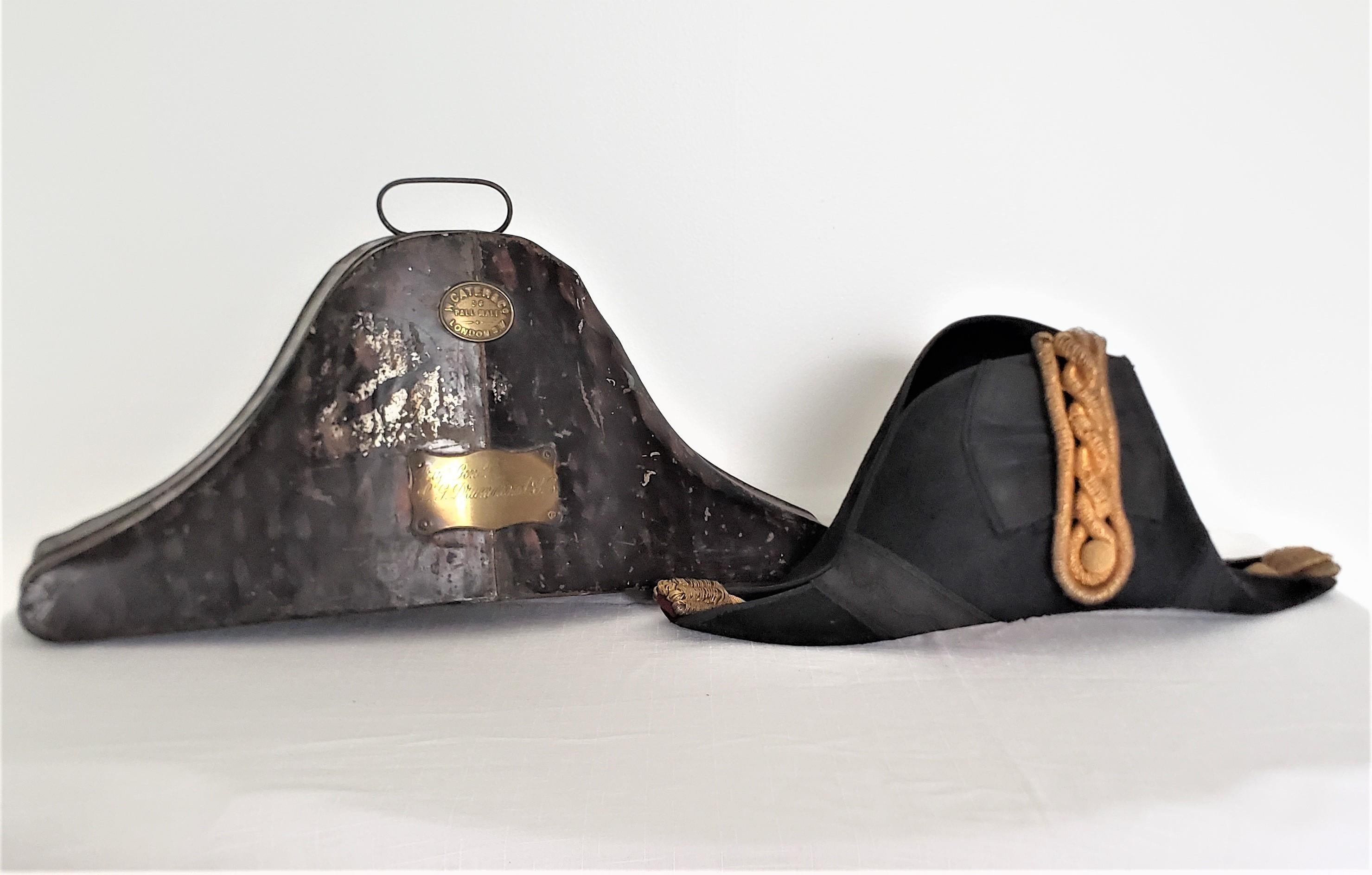 This antique military hat and fitted hat box was made by W. Cater of London England for the Brigadier General Lawrence Drummond in approximately 1915 in the period style. The hat is shaped in the period bi-cornered manner with gold tassels and is