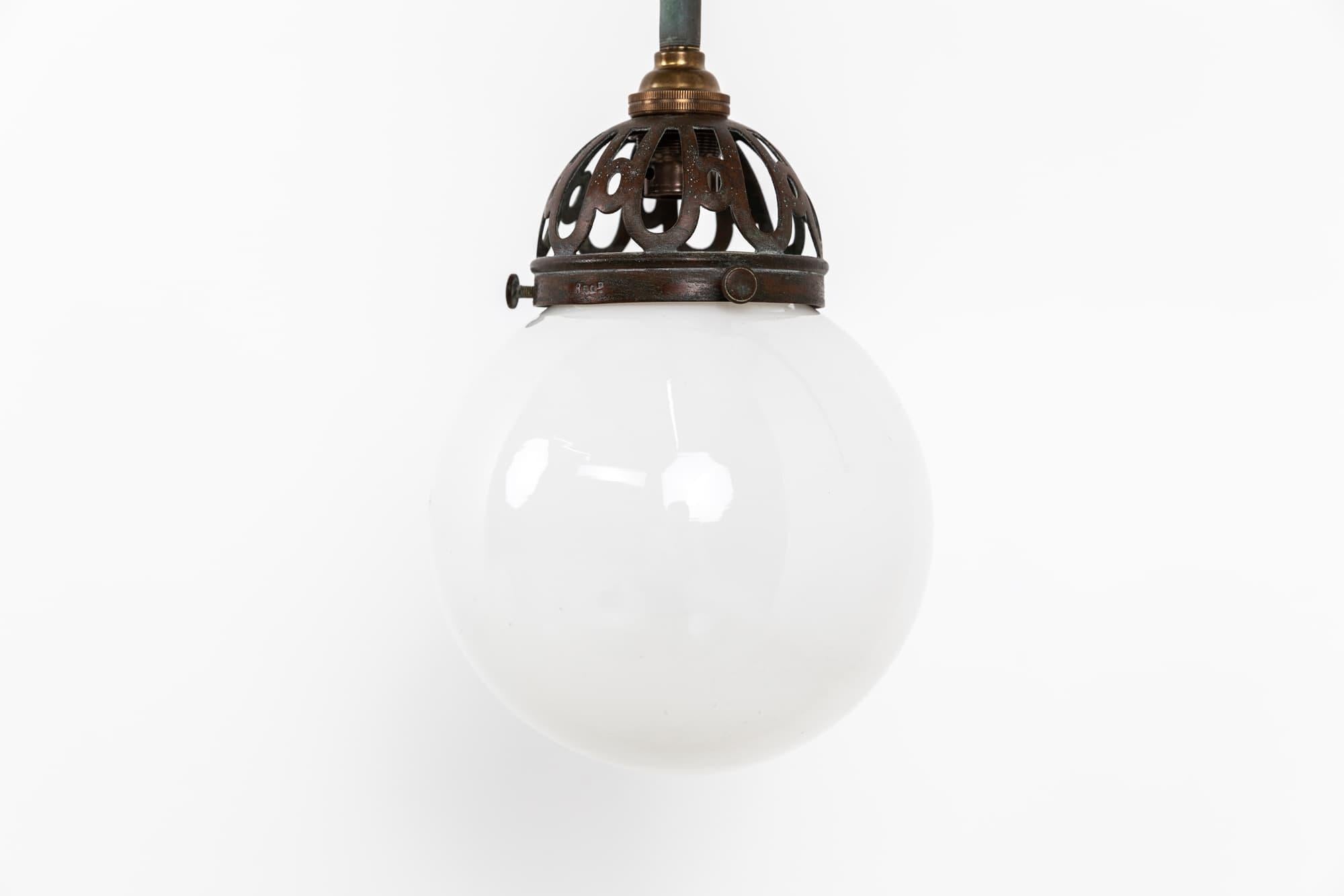 

An elegant former gas wall lamp with opaline shade. c.1920

Brass construction with pierced GEC gallery and diminutive globe opaline glass shade. 

This lamp could be wired to a plug or direct to mains, depending on preference.
