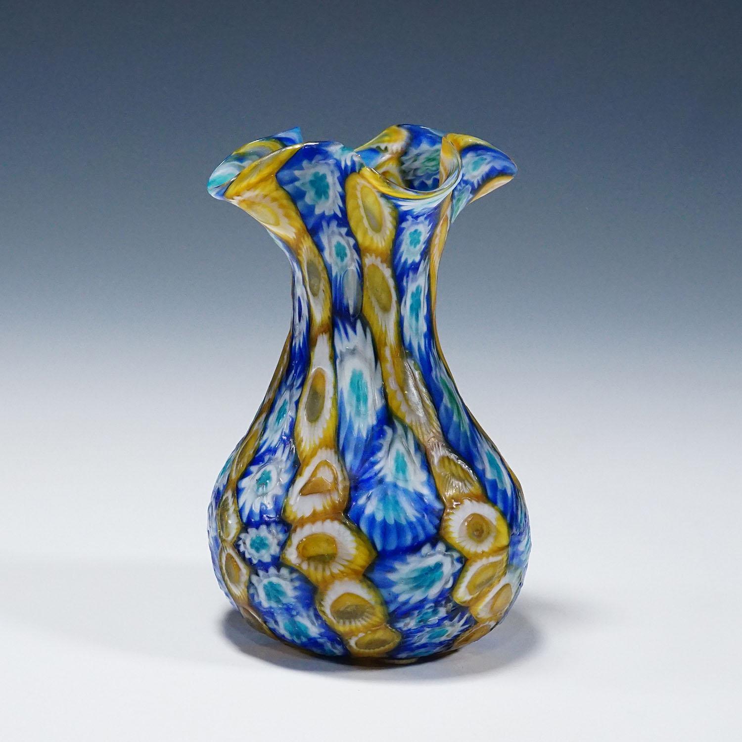 Antique Millefiori Vase, Fratelli Toso Murano ca. 1920s
Item e7091
An antique millefiori murrine glass vase manufactured by Vetreria Fratelli Toso, Murano around 1920. Made of polychrome murrines (blue, yellow and white) which were melted together.