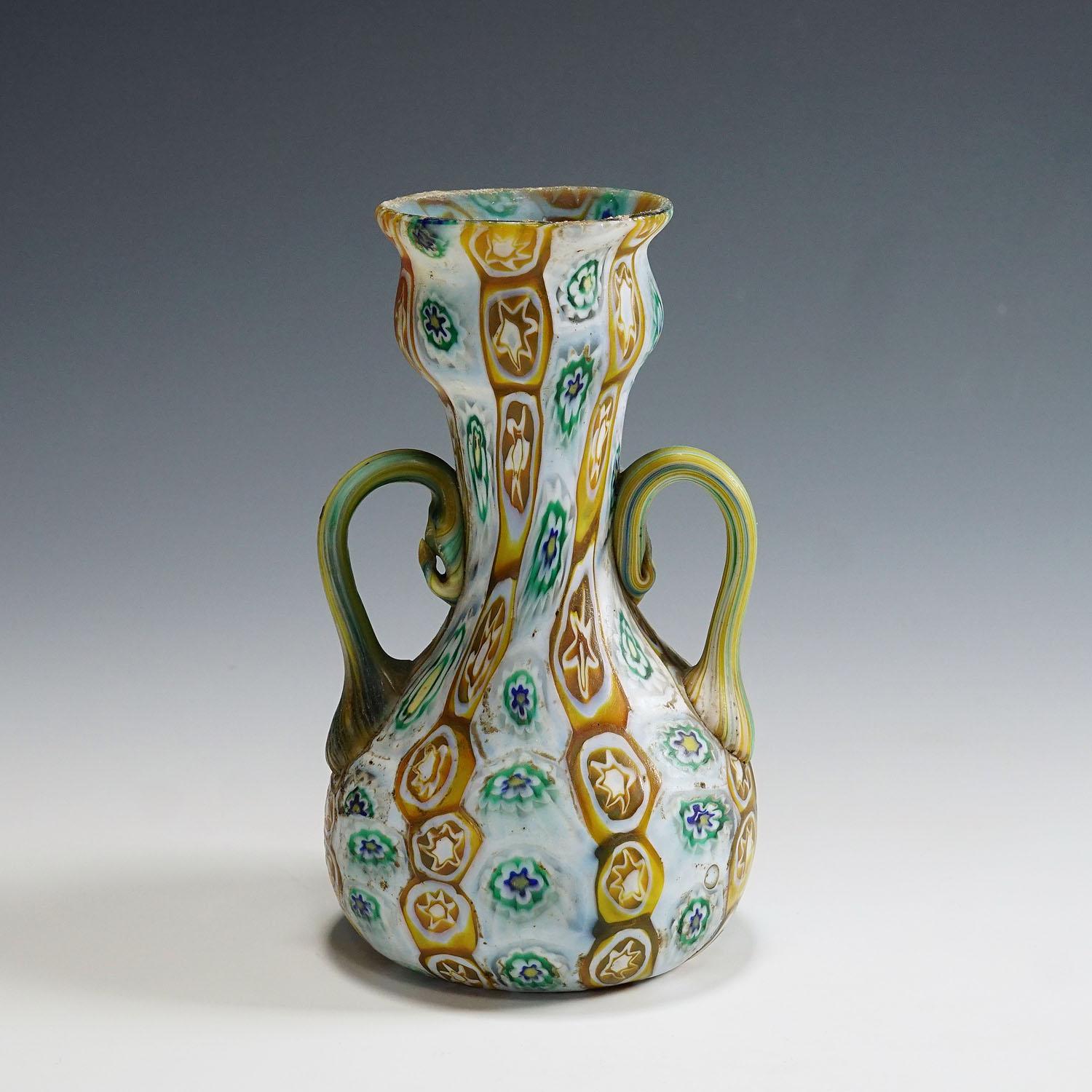 Antique Millefiori Vase in Brown, Green and White, Fratelli Toso Murano 1910

An antique Millefiori murrine glass vase manufactured by Vetreria Fratelli Toso, Murano around 1910. Made of melted polychrome murrines in light brown, green, and white.