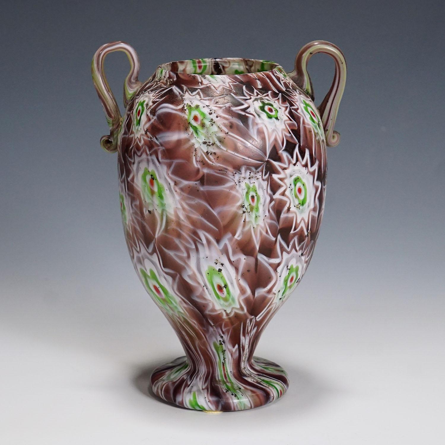 Antique Millefiori Vase in Purple, Green and White, Fratelli Toso Murano 1910

An antique Millefiori murrine glass vase manufactured by Vetreria Fratelli Toso, Murano around 1910. Made of melted polychrome murrines in purple, green, and white.