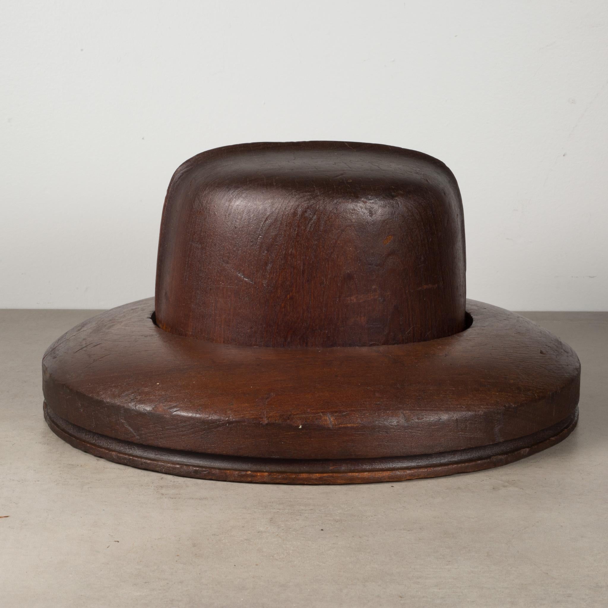 About

An original wooden millinery wide brim hat form with various stamps 