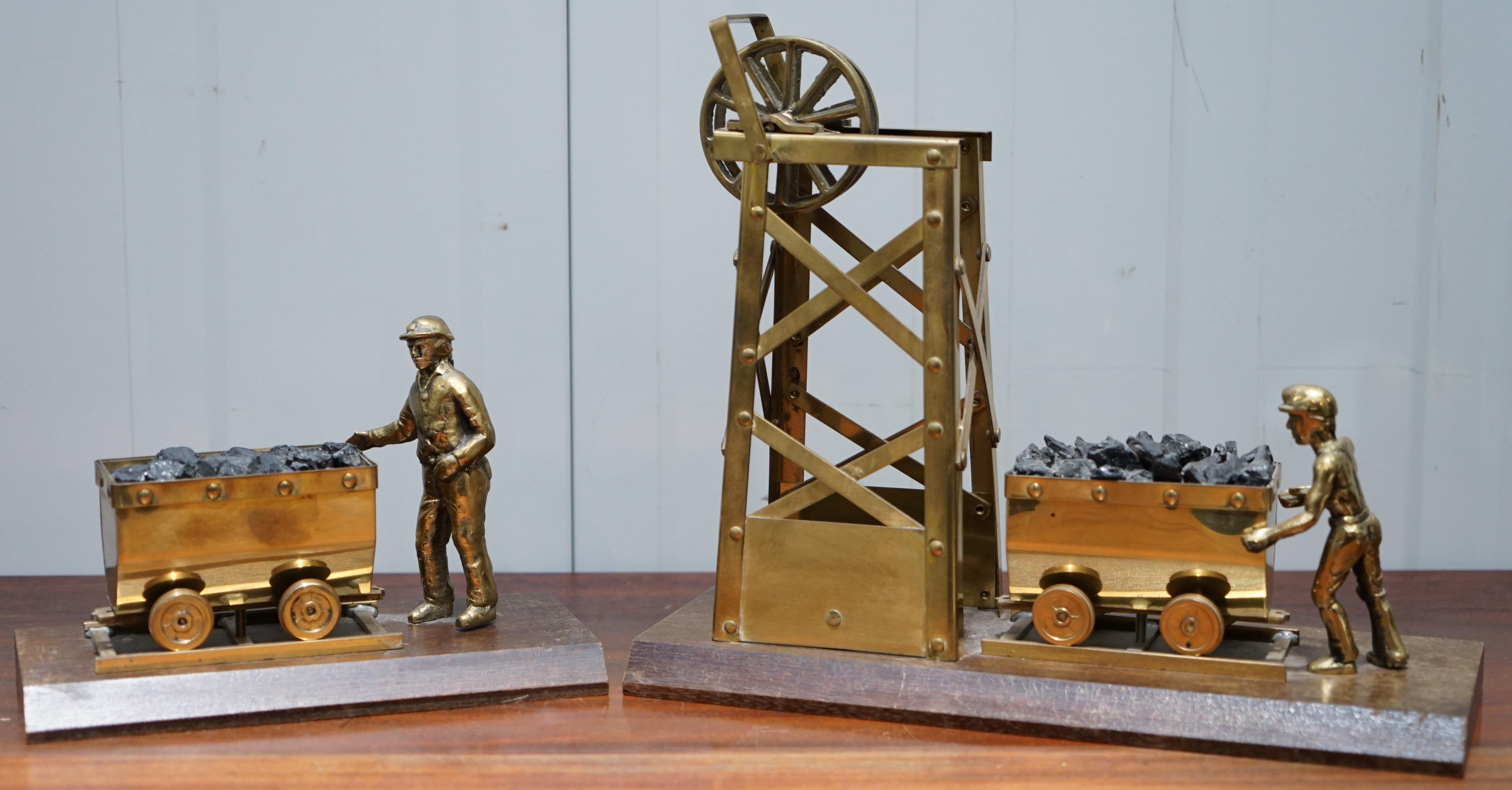 We are delighted to offer for sale this lovely display of a pair of statues and a miner’s safety lamp 

A good looking and decorative set, both statues are nicely cast in brass, the wheel has movement to it at the top of the large statue, the lamp