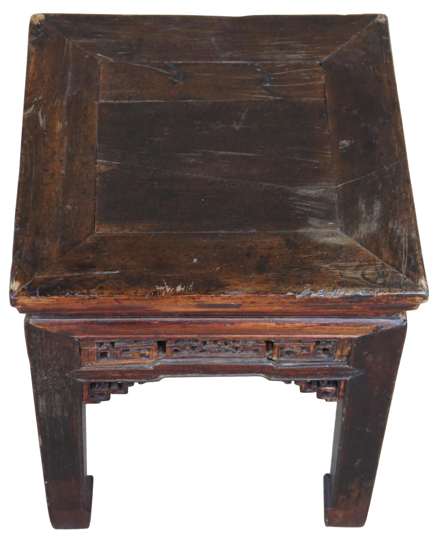 Antique Ming dynasty style table. Made from elm with mortise and Tenon joints and intricately caved fretwork.
   