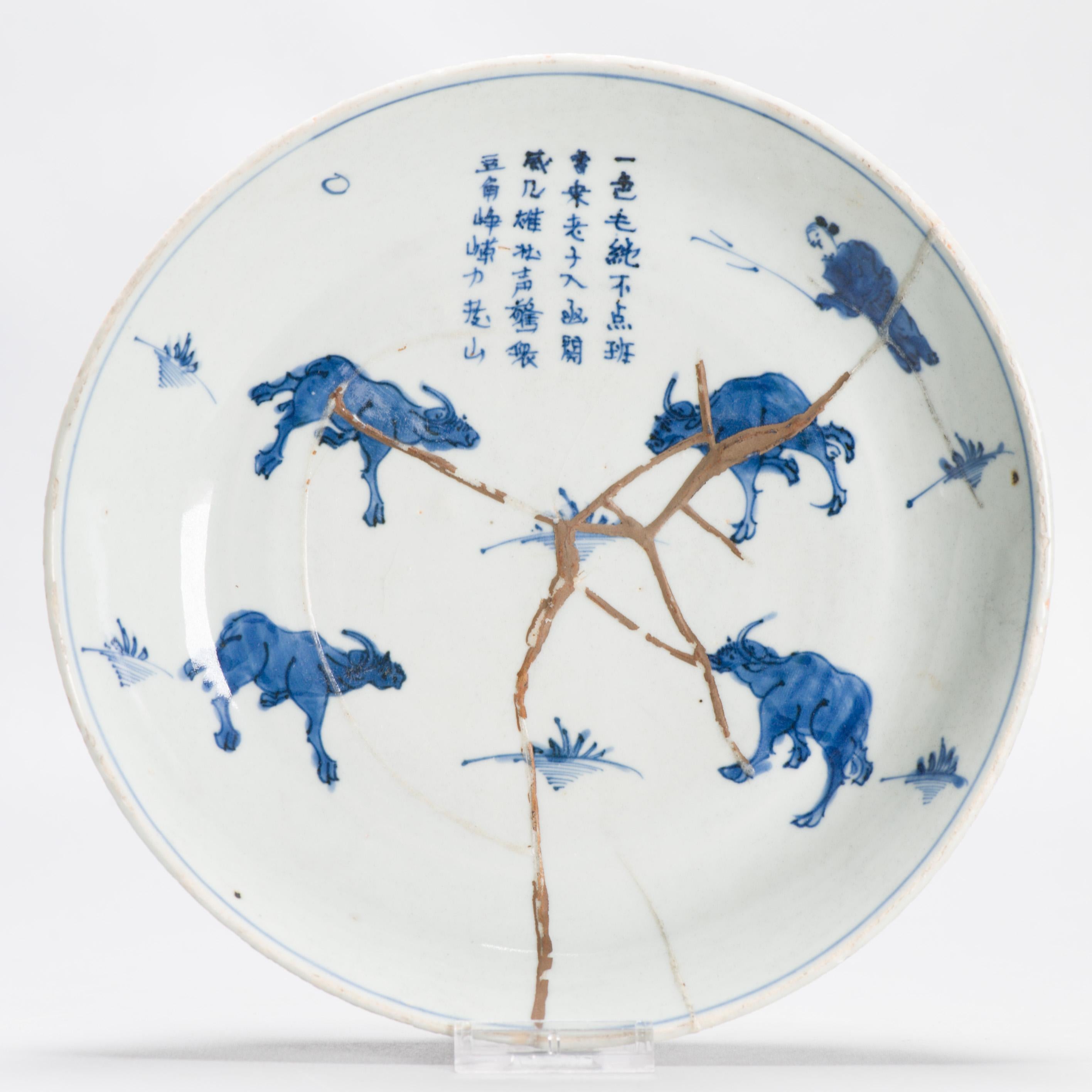 A Chinese blue and white porcelain Dish of beautiful shape and design.
Visible is a scene of a sheperd with cows. A poem is also visible at the top.
Early 17th century.
Similar dishes are pictured from the literature.

Condition
Interesting