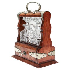 Antiguo decantador de viaje o de perfume en miniatura del s. XIX Tántalo de roble y cristal tallado