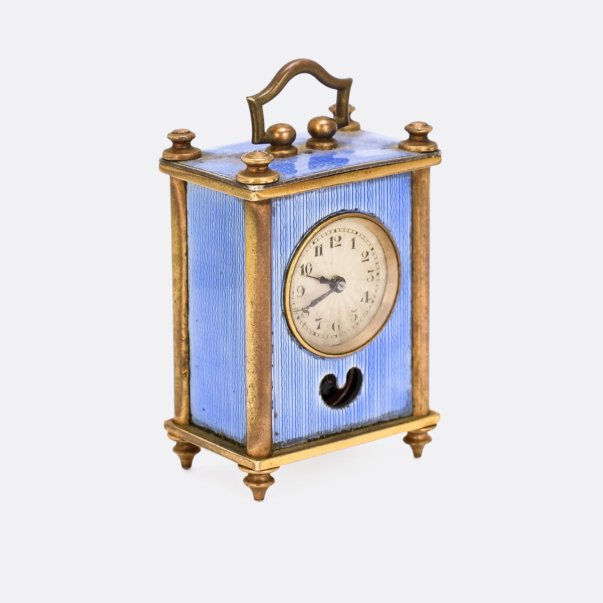 A remarkable (and tiny) miniature carriage clock dating from the early 20th century, circa 1920. It's made by Swiss clock maker, Theodore Jequier and features his patented Brevit #93017 movement. It's finished in light blue guilloché enamel and