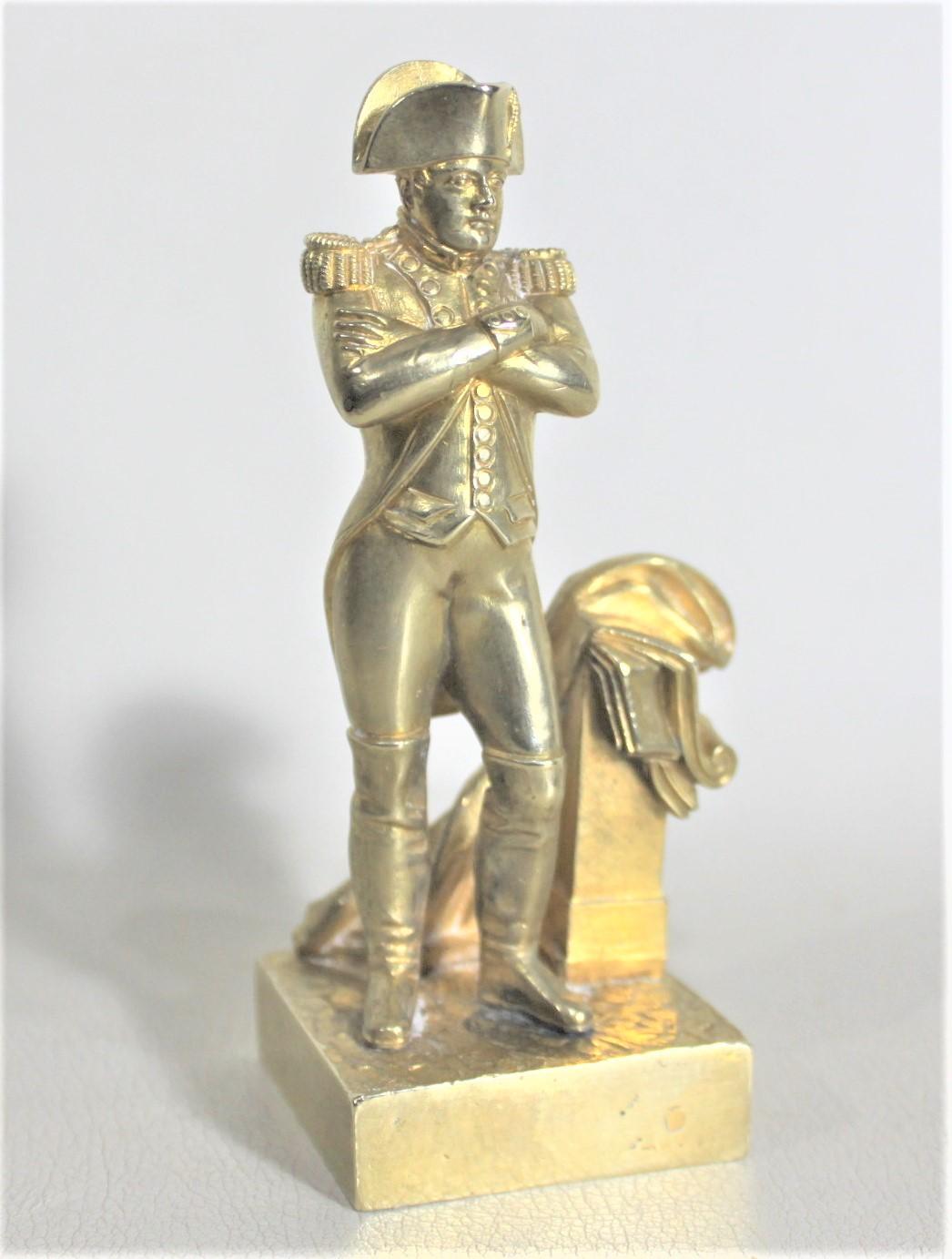 This well executed gilt bronze sculpture is unsigned, but presumed to have been made in France in approximately 1890 in the Epoch era style. This miniature gilt bronze depicts Napoleon in his uniform and is very detailed on all sides.