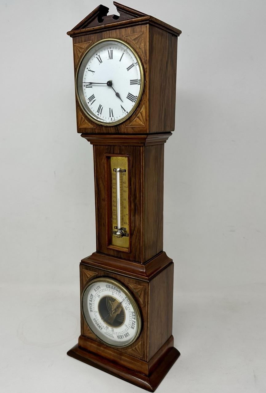 An Exceptionally Fine Quality English Well Figured Flame Mahogany with attractive Sheraton Style Boxwood Shell Inlay Miniature Grandfather Combination Time Piece, Long Clock, Thermometer and Barometer of outstanding quality and of seldom seen taller