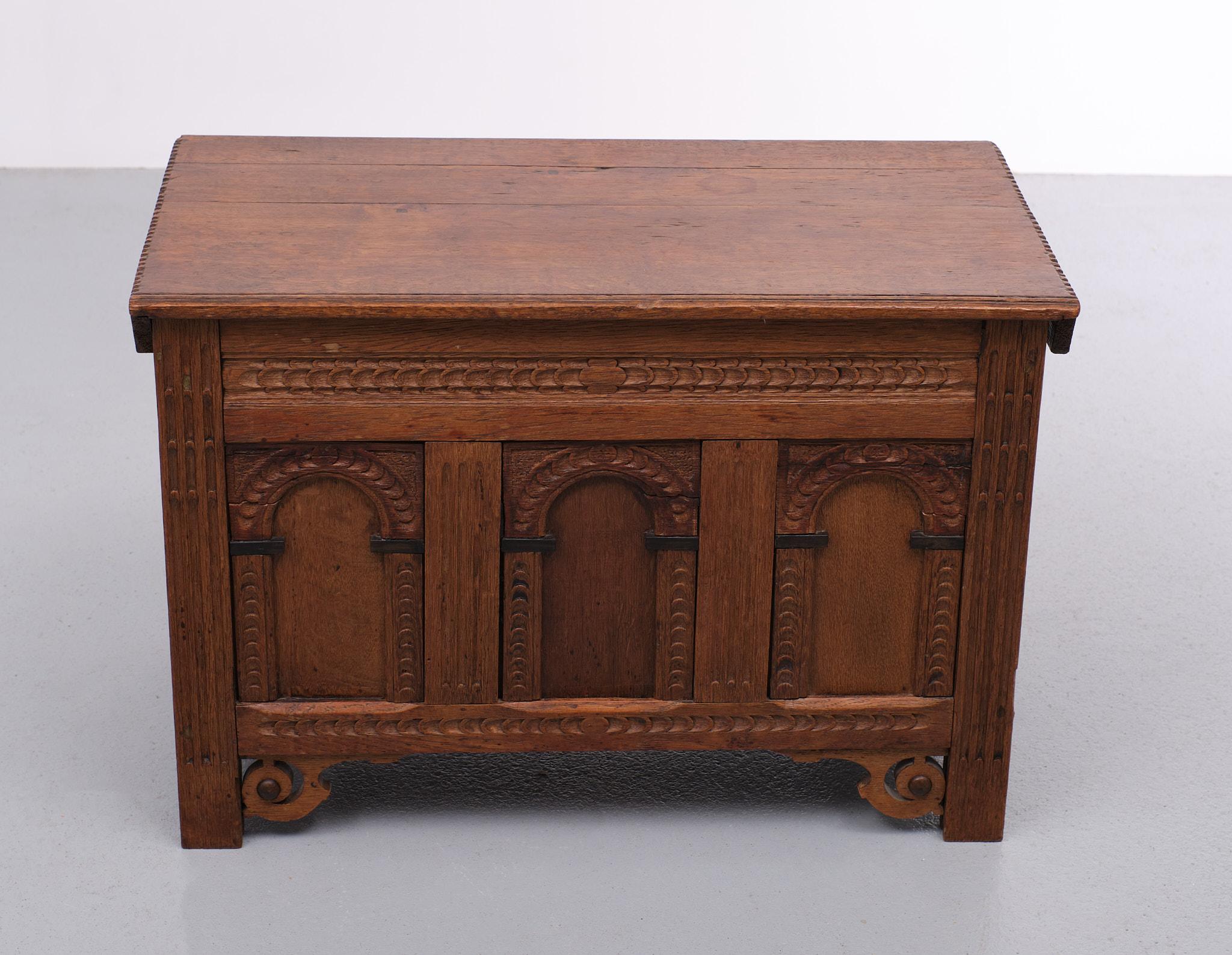 For sale this beautiful miniature blanket chest. Solid oak with Ebony details. 
 early 19th century three panels on the front. Very nice patine on the oak wood.
Hand carved. Still very useful. The hinges are replaced. 
P S its not my real face.
