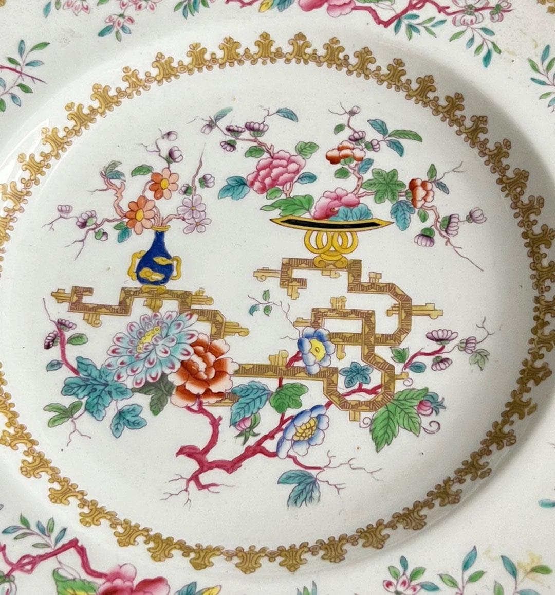 An early antique Minton Chinese Tree chinoiserie plate with scalloped edge. Signed on back pattern number 1959. Chinese tree with vases of peonies and blossoms hand painted. Circa 1840s.