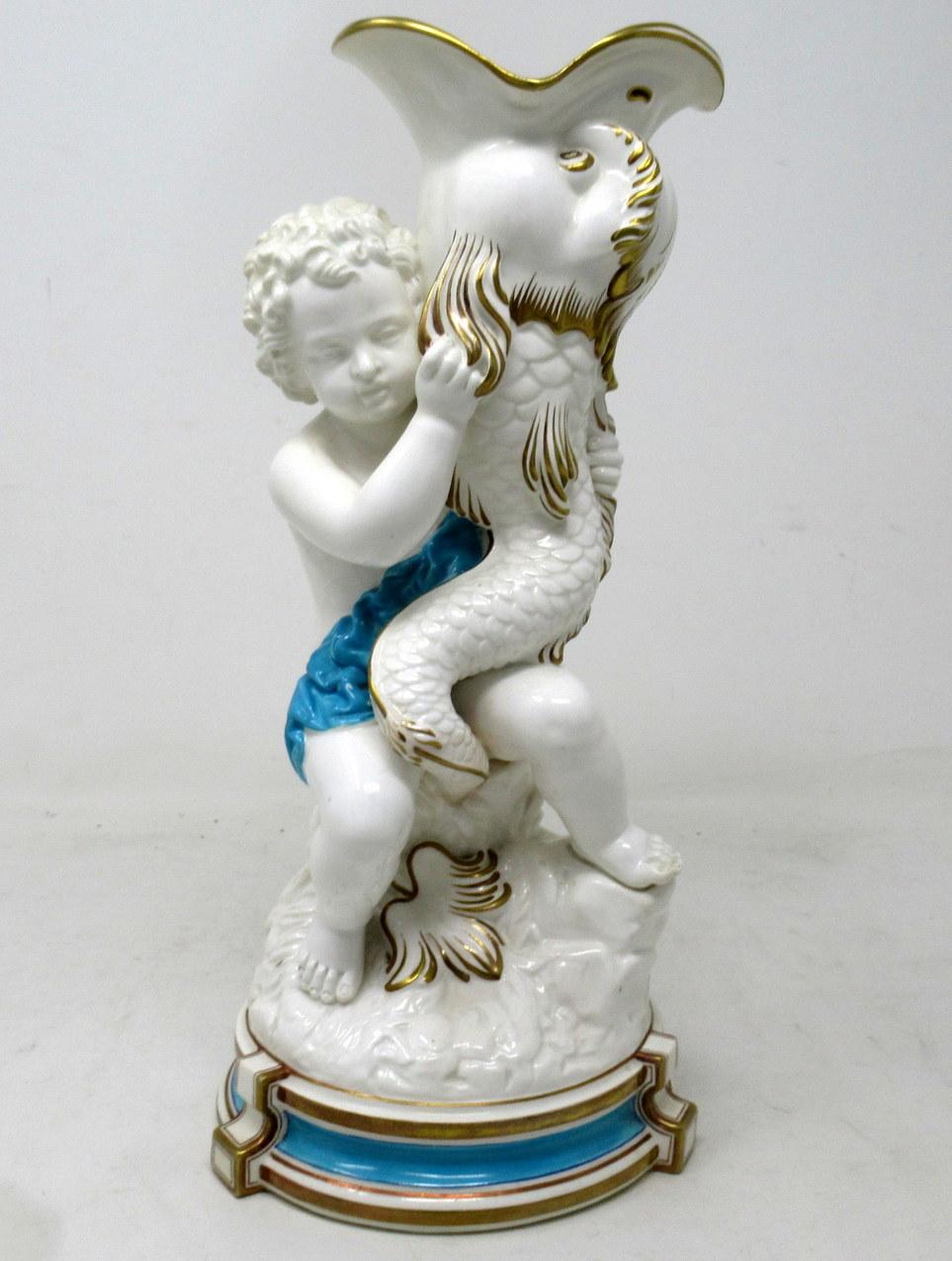 Stunning example of an English Minton Porcelain centerpiece or flower vase, depicting an entwined upright Dolphin been help by a scantily clad Female standing on a naturalistic circular base. Circa third quarter of the Nineteenth Century.