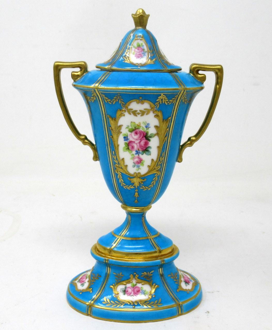 Stunning Example of an English Minton Porcelain twin handle lidded Vase of ovoid form of outstanding quality. 

Each central oval reserve exquisitely hand painted depicting Old Summer Roses within a lavish raised gilt surround, the spreading base
