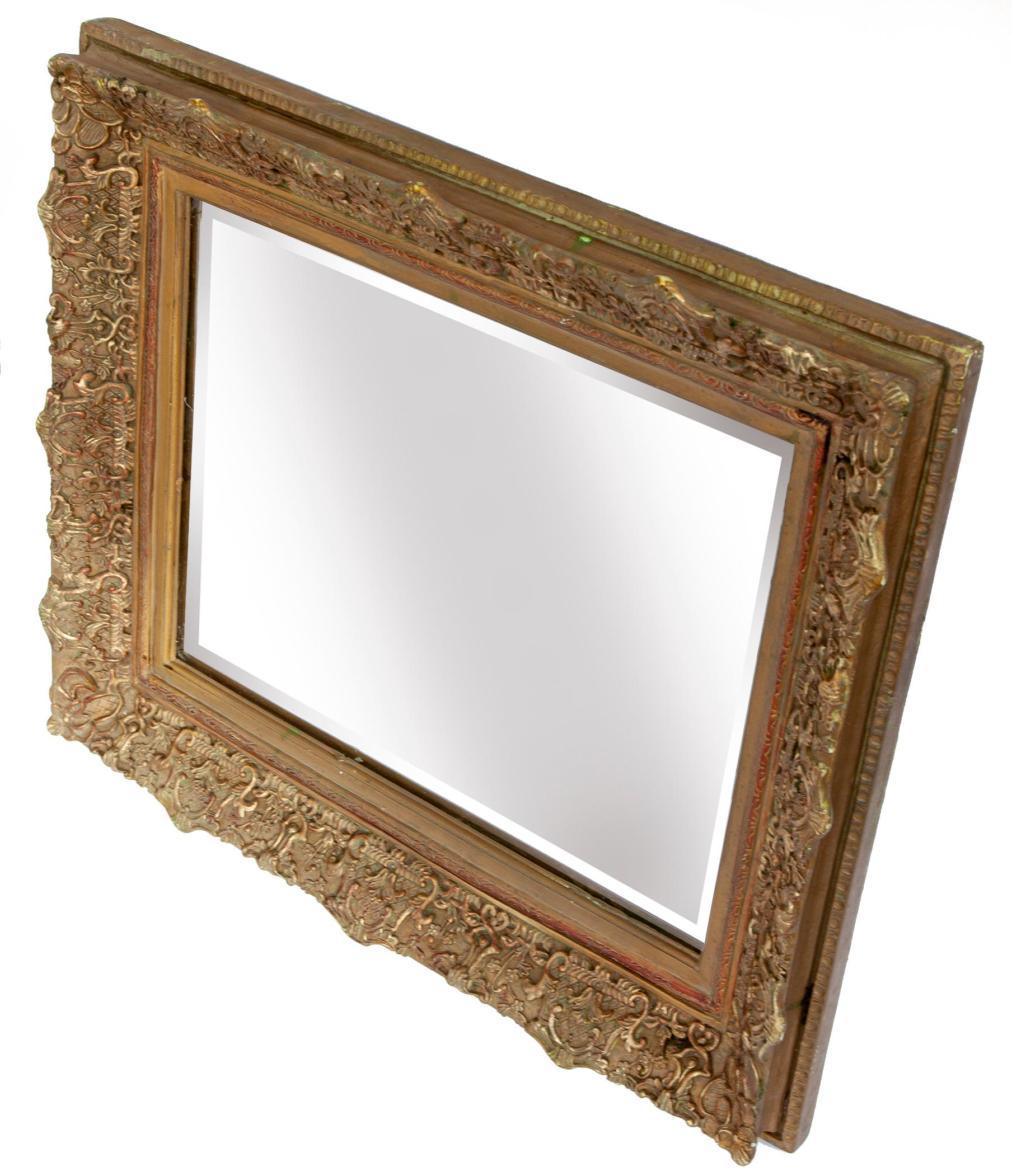 A late 19th century early 20th century Victorian framed beveled mirror with decorative surfaces & deep well, a lovely example of Victorian style. 
Very heavy & sturdy construction.