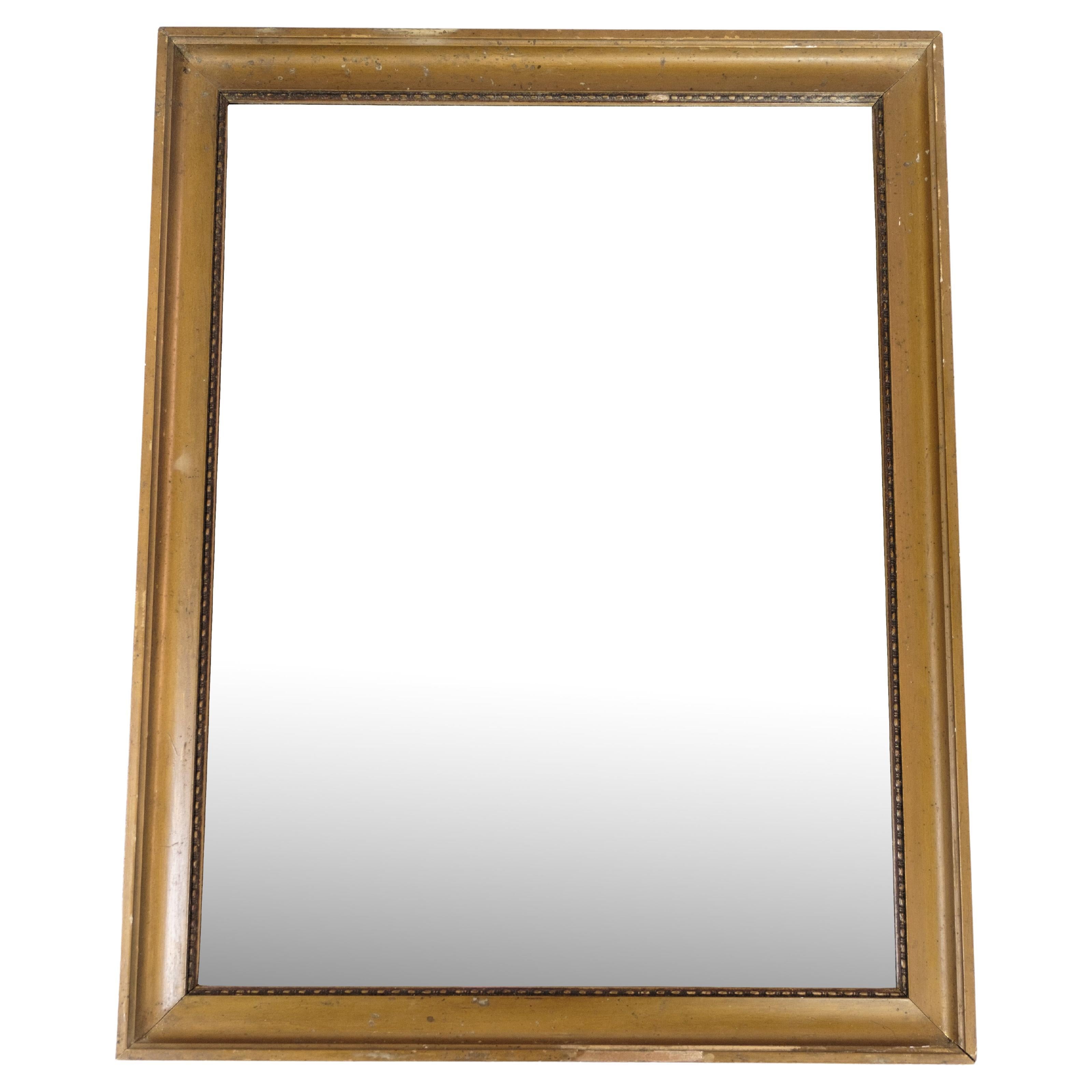 Antique mirror with a gilded frame from around the 1930s.
Dimensions in cm: H:57 W:44

This product will be inspected thoroughly at our professional workshop by our educated employees, who assure the product quality