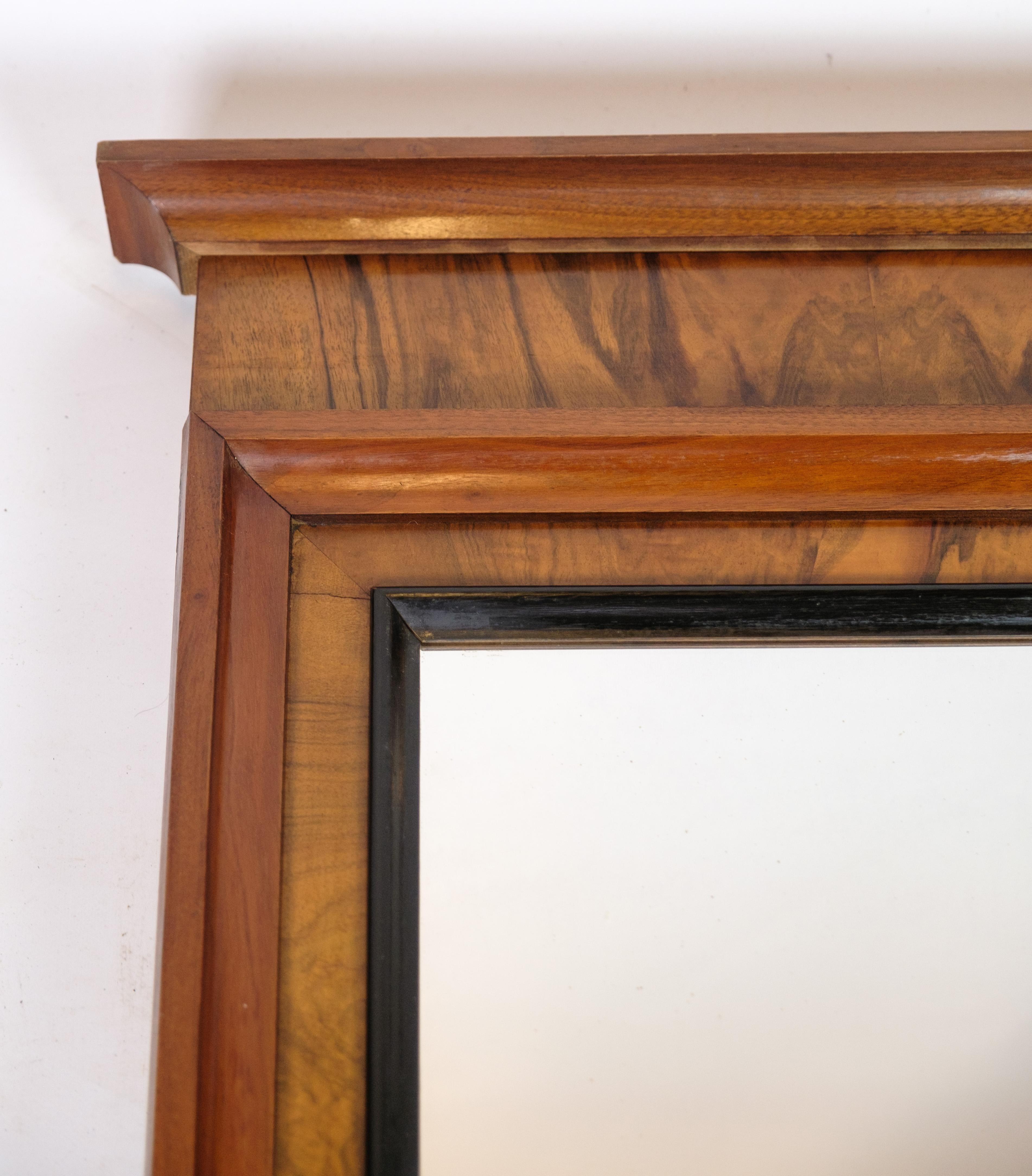 Antique mirror in mahogany wood from the late Empire period from around the 1840s. Light in colour, due to sunlight over the years.
Dimensions in cm: H:125 W:59