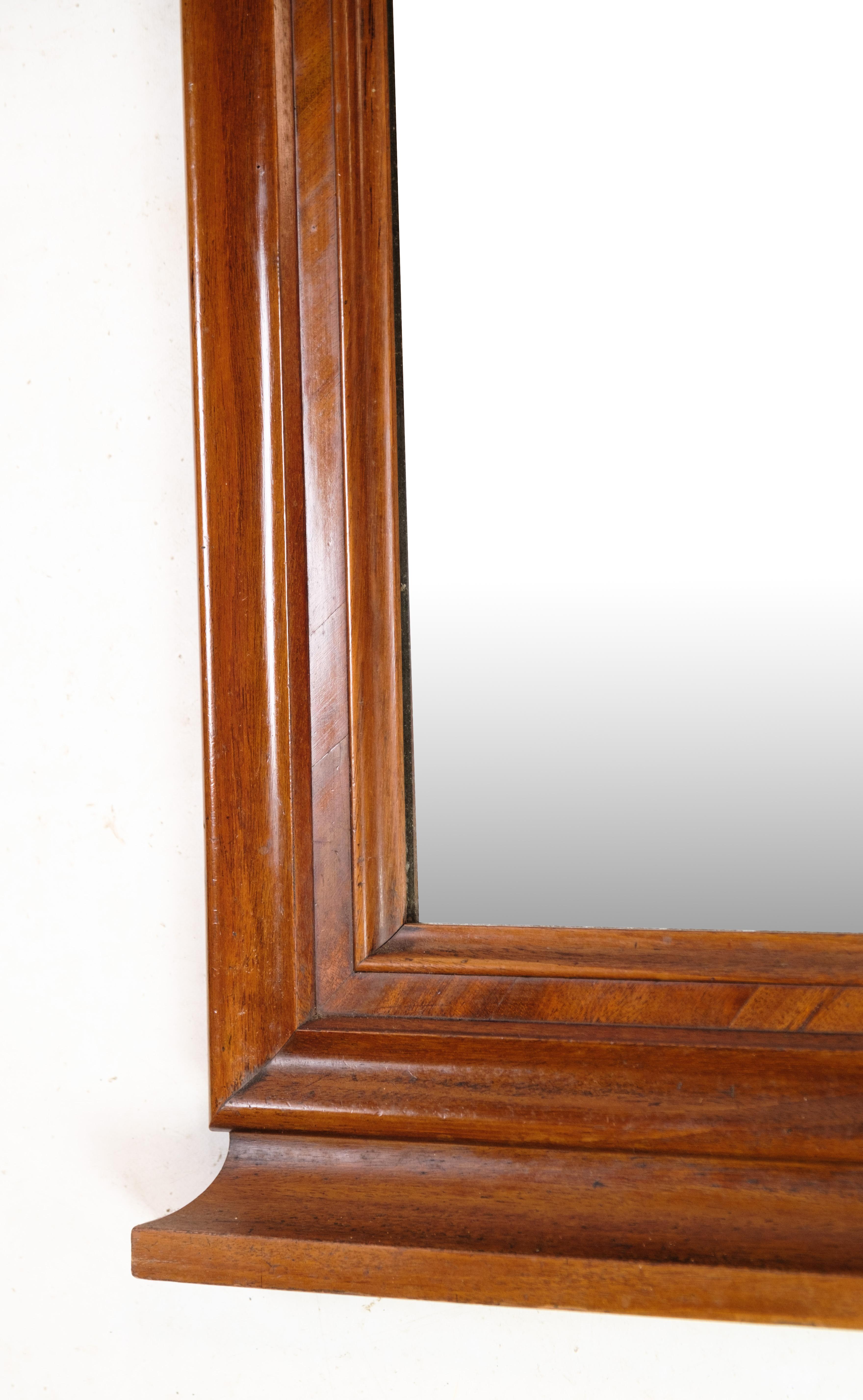 Danish Antique Mirror in Mahogany Wood, Decorated with Carvings from Around the 1860s For Sale