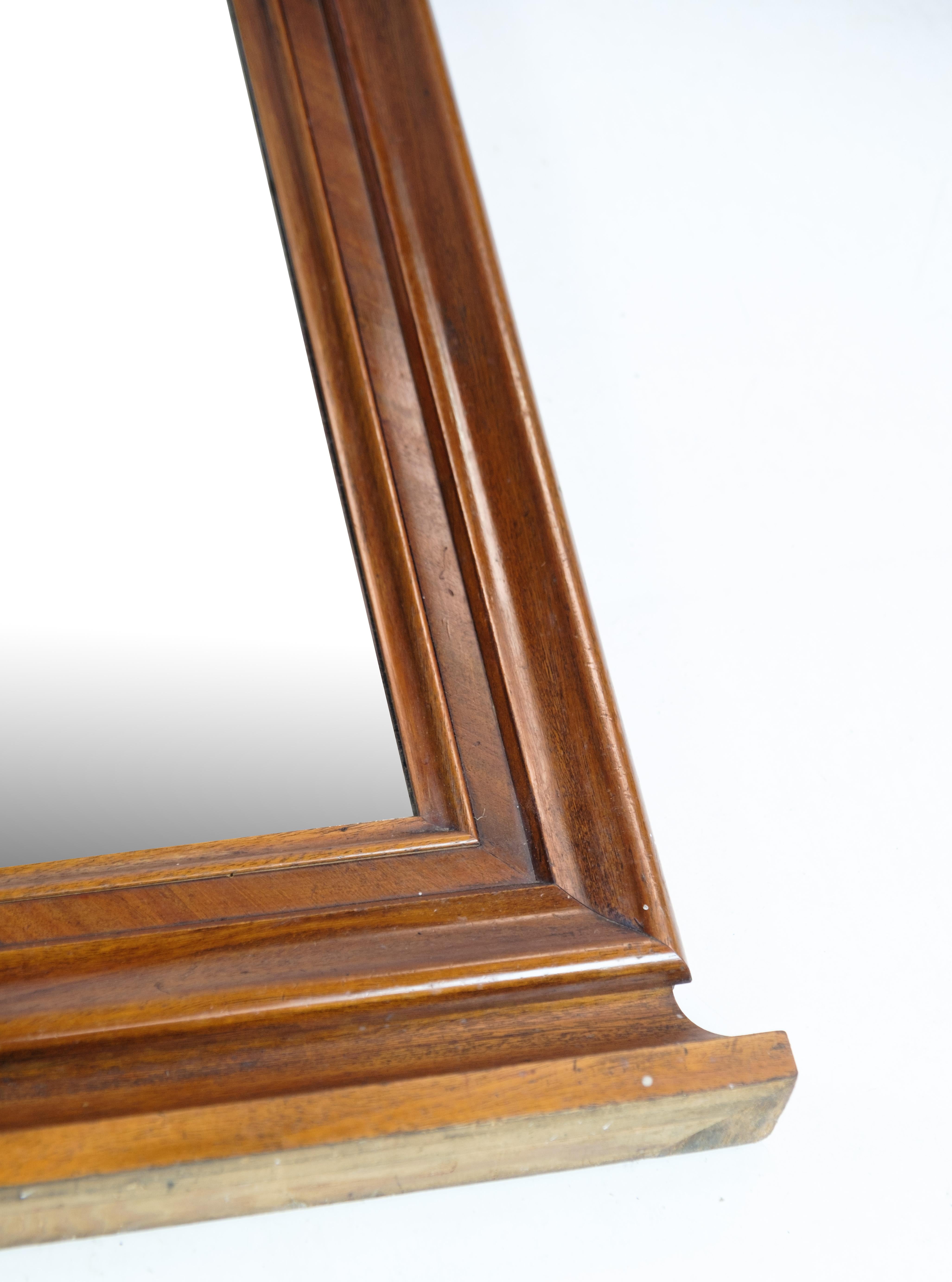 Mid-19th Century Antique Mirror in Mahogany Wood, Decorated with Carvings from Around the 1860s For Sale