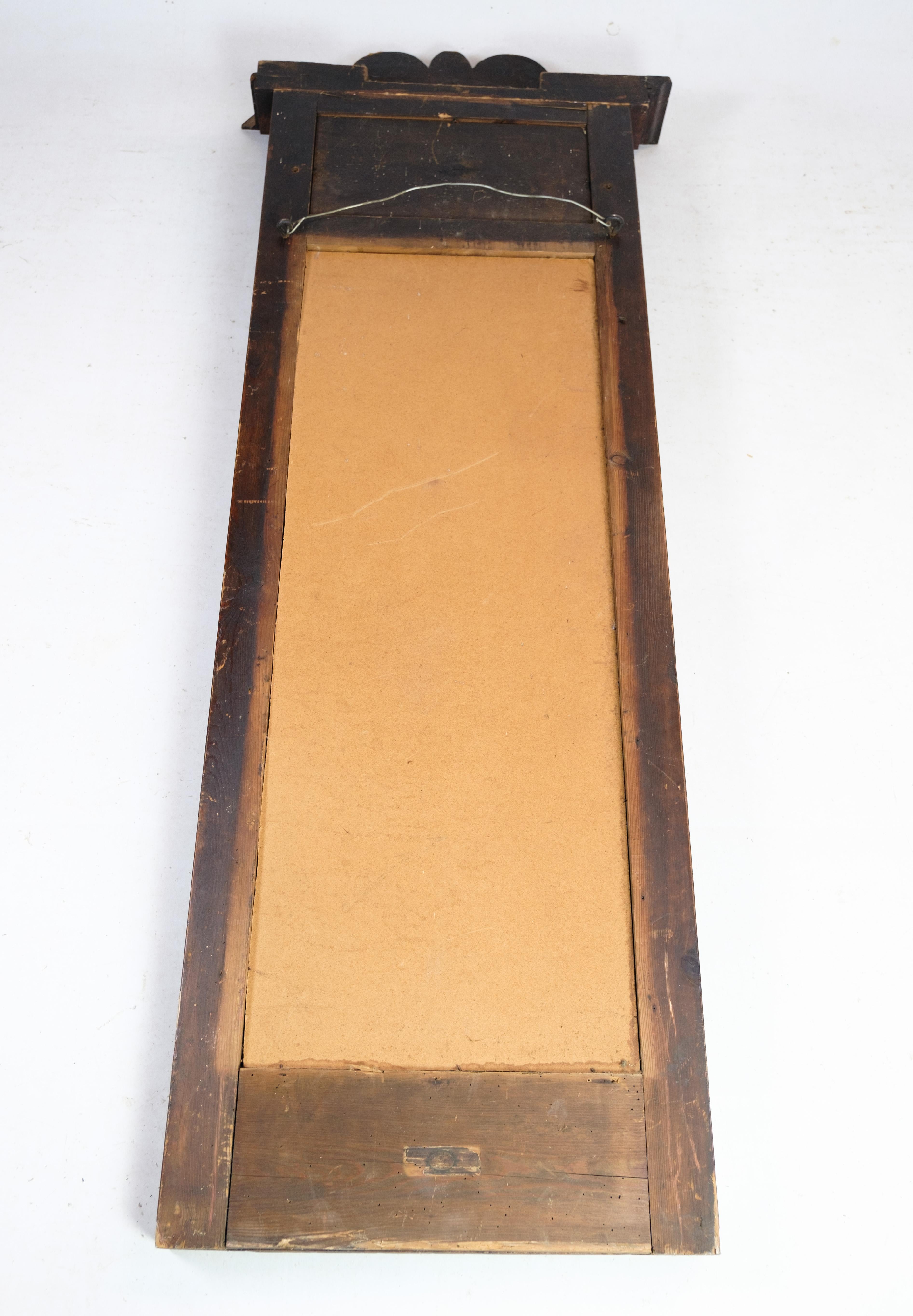 Antique mirror in mahogany from the late Empire period from around the 1840s.
Dimensions in cm: H:160 W:61.