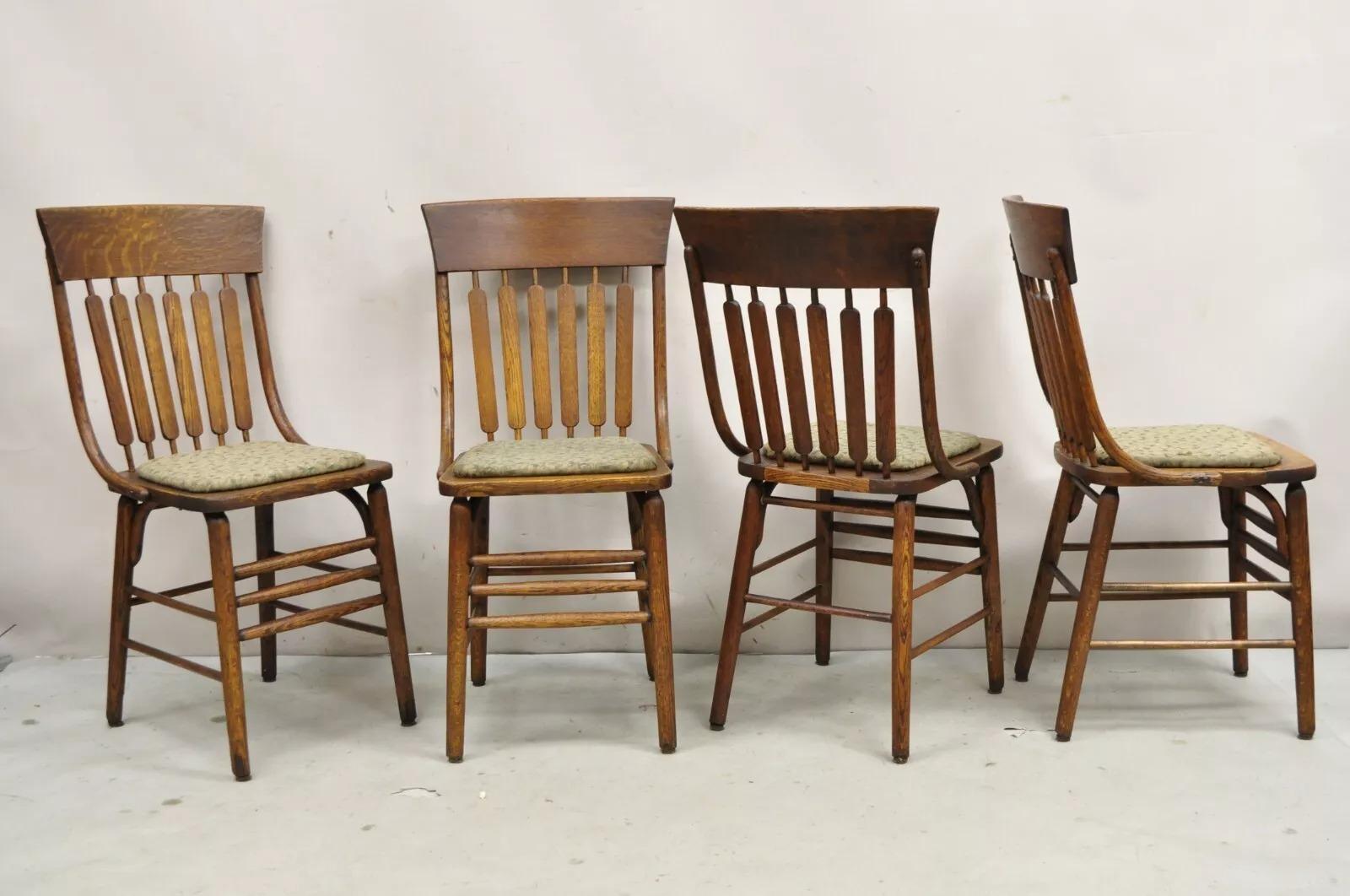 Antique Mission Arts & Crafts Oak Bentwood Slat Back Dining Chairs with Hard Seat Cushion - Set of 4. Circa Early 20th Century. Measurements: 36