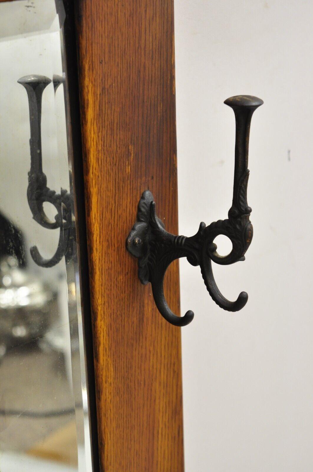 Antique Mission Arts & Crafts Oak Wood Beveled Glass Hall Mirror Iron Coat Hooks In Good Condition For Sale In Philadelphia, PA
